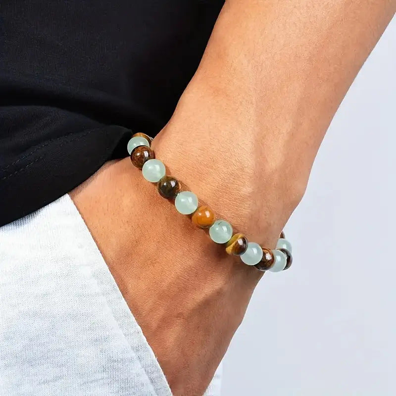 Beaded bracelet on a wrist with a neutral background