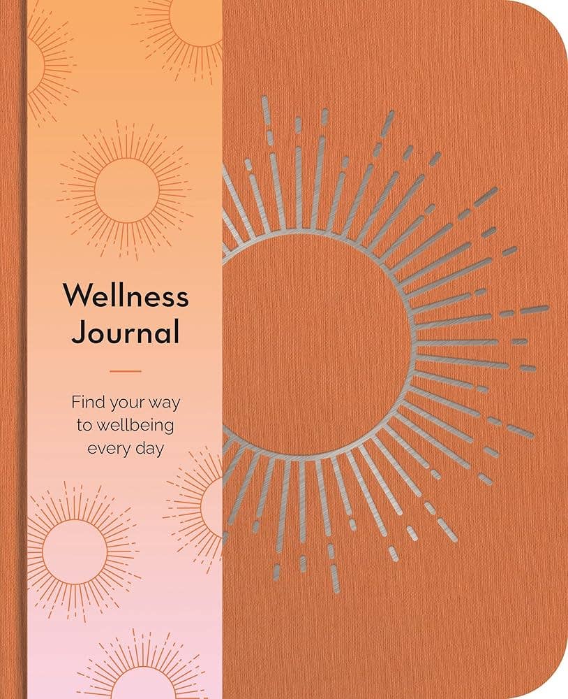 Wellness journal with sun design and text on a two-tone cover