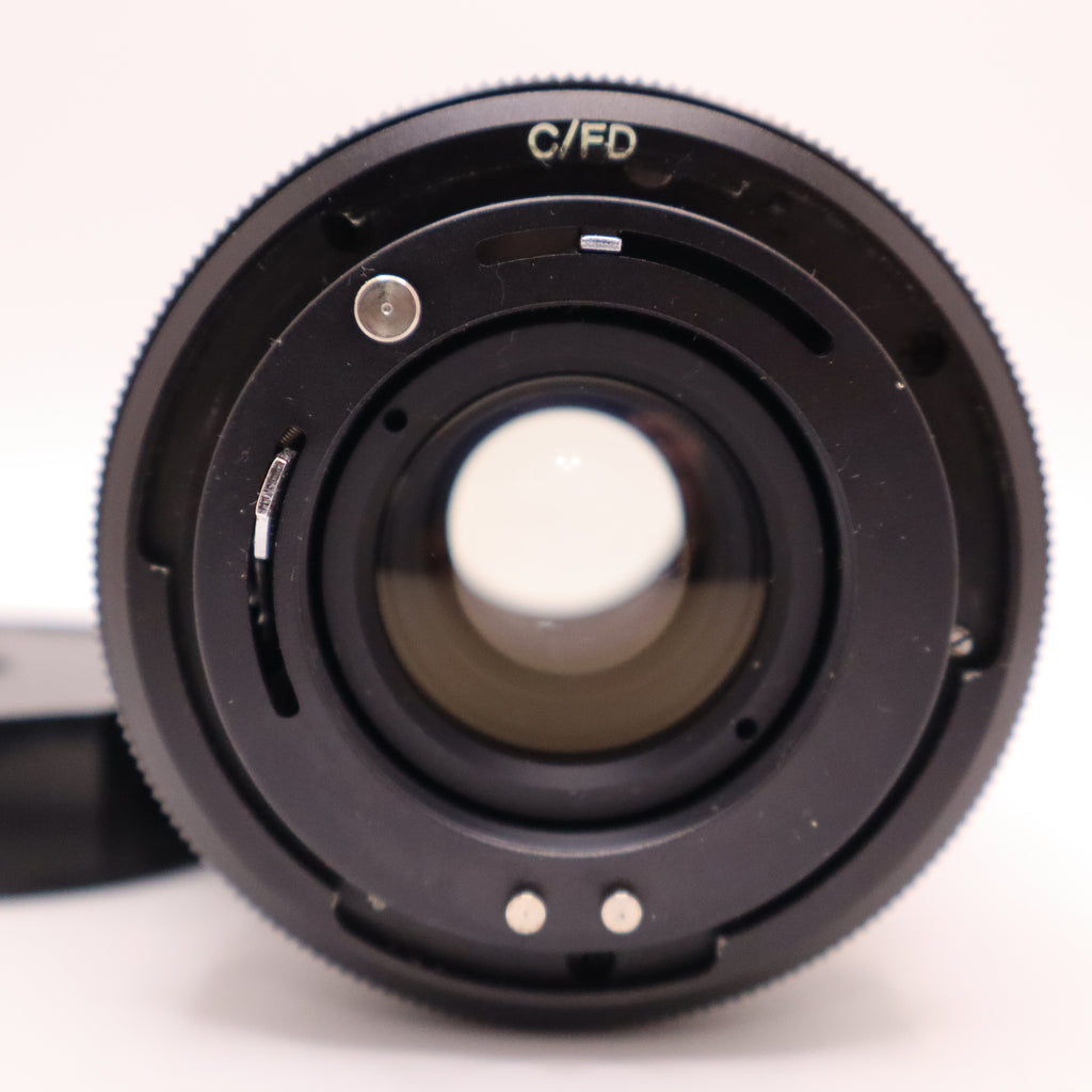Close-up of a camera lens on a white background