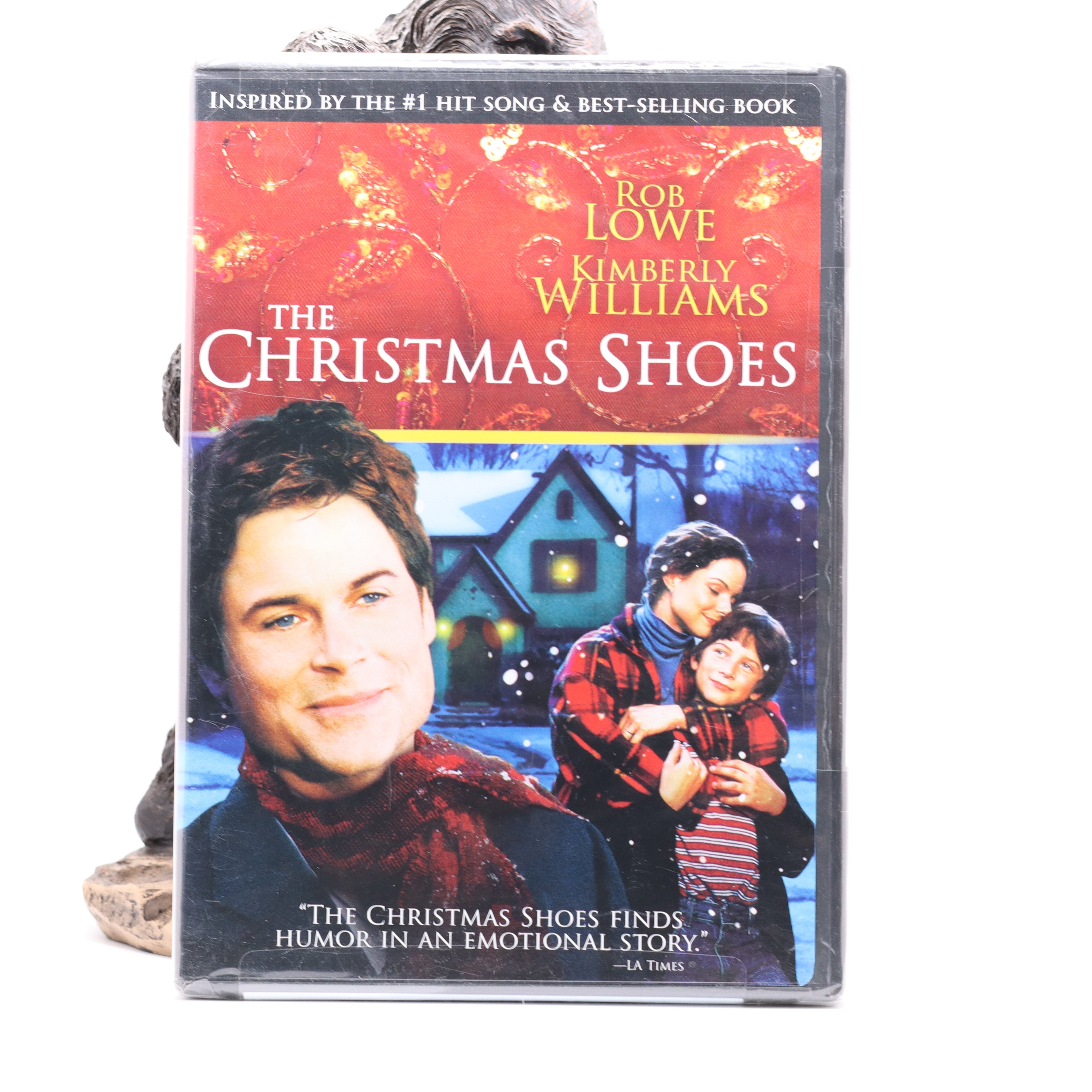 DVD cover of 'The Christmas Shoes' with a family scene and text about the movie.