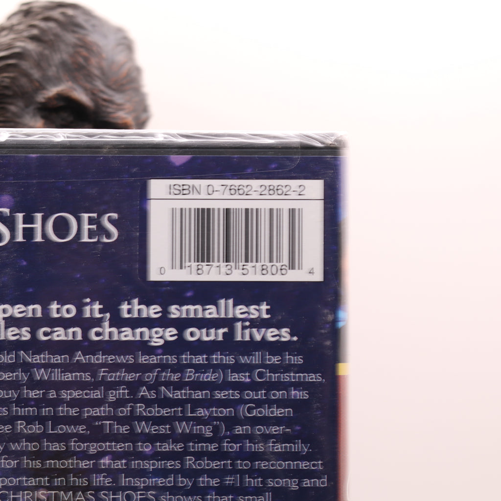 Back cover of a book with text and a barcode on a white background