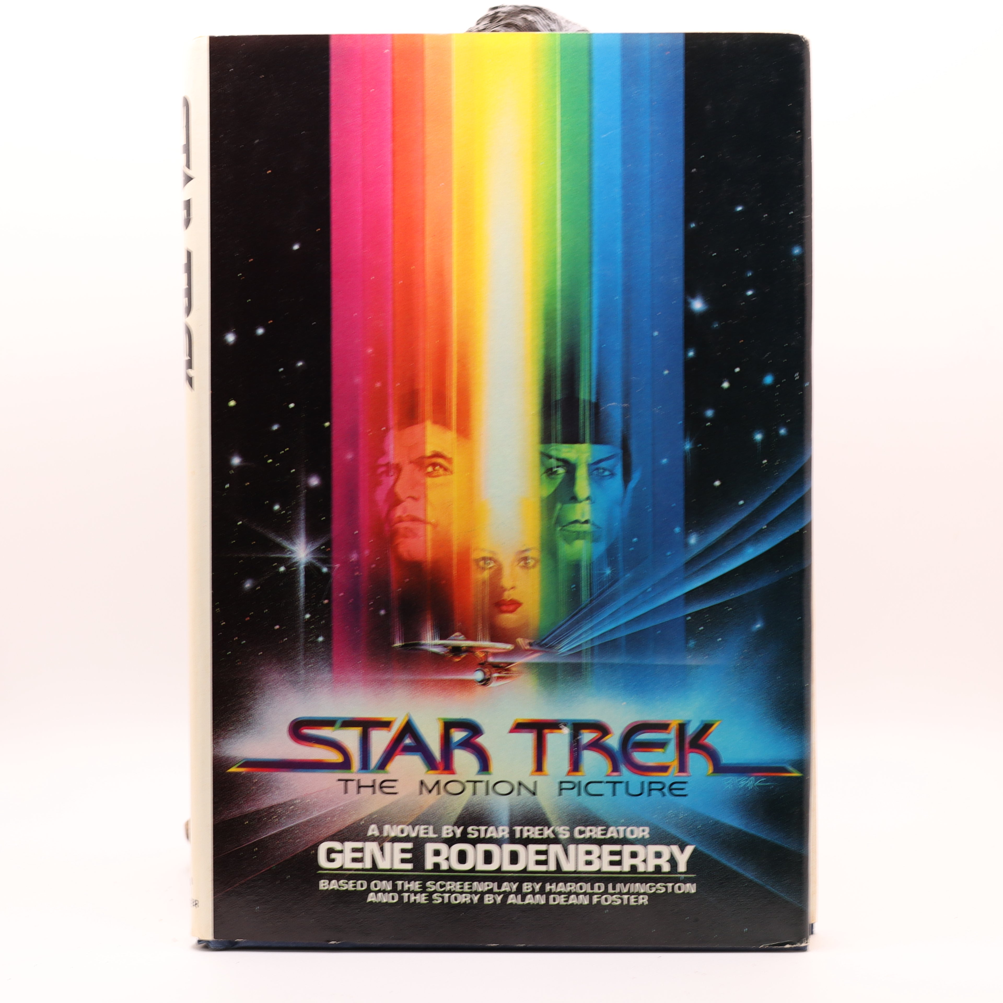 Book cover of 'Star Trek: The Motion Picture' by Gene Roddenberry with colorful design and spaceship illustration.