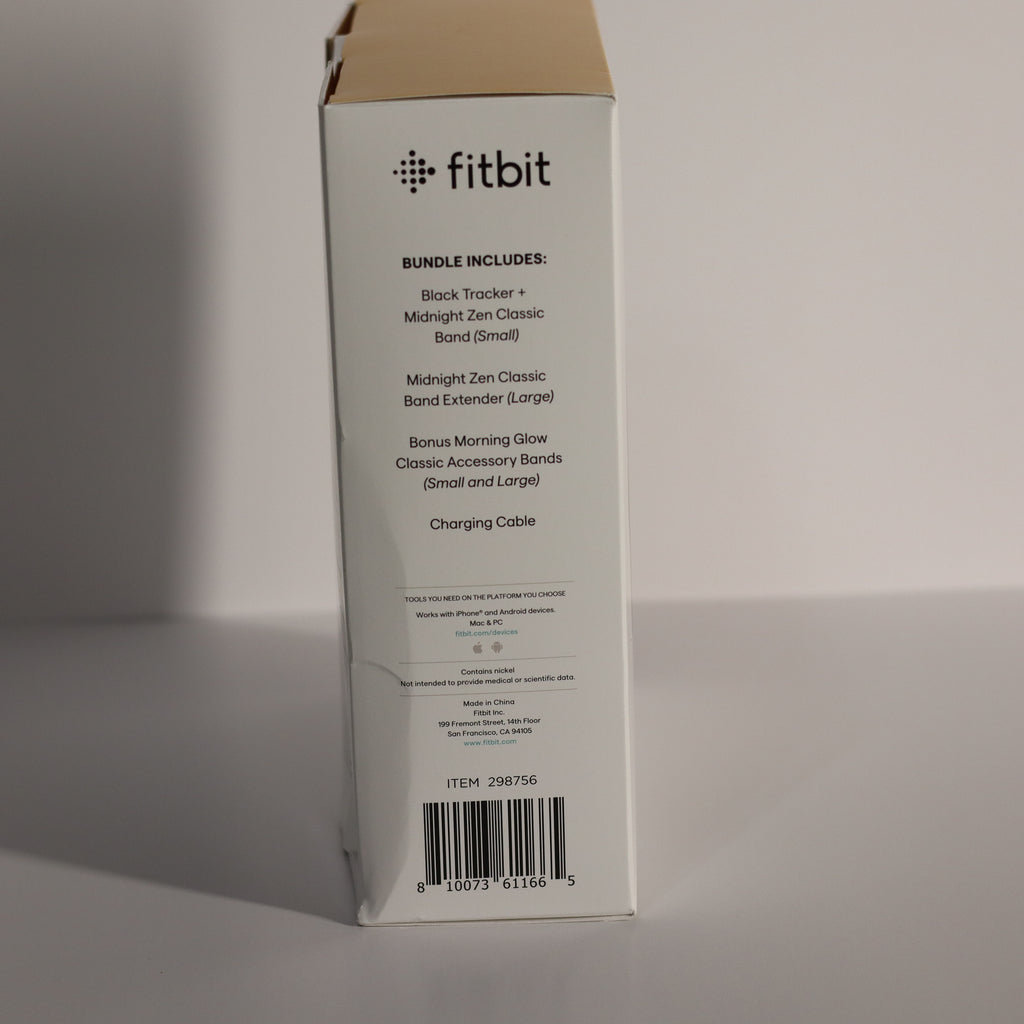 Fitbit product packaging box with item details on a gray background