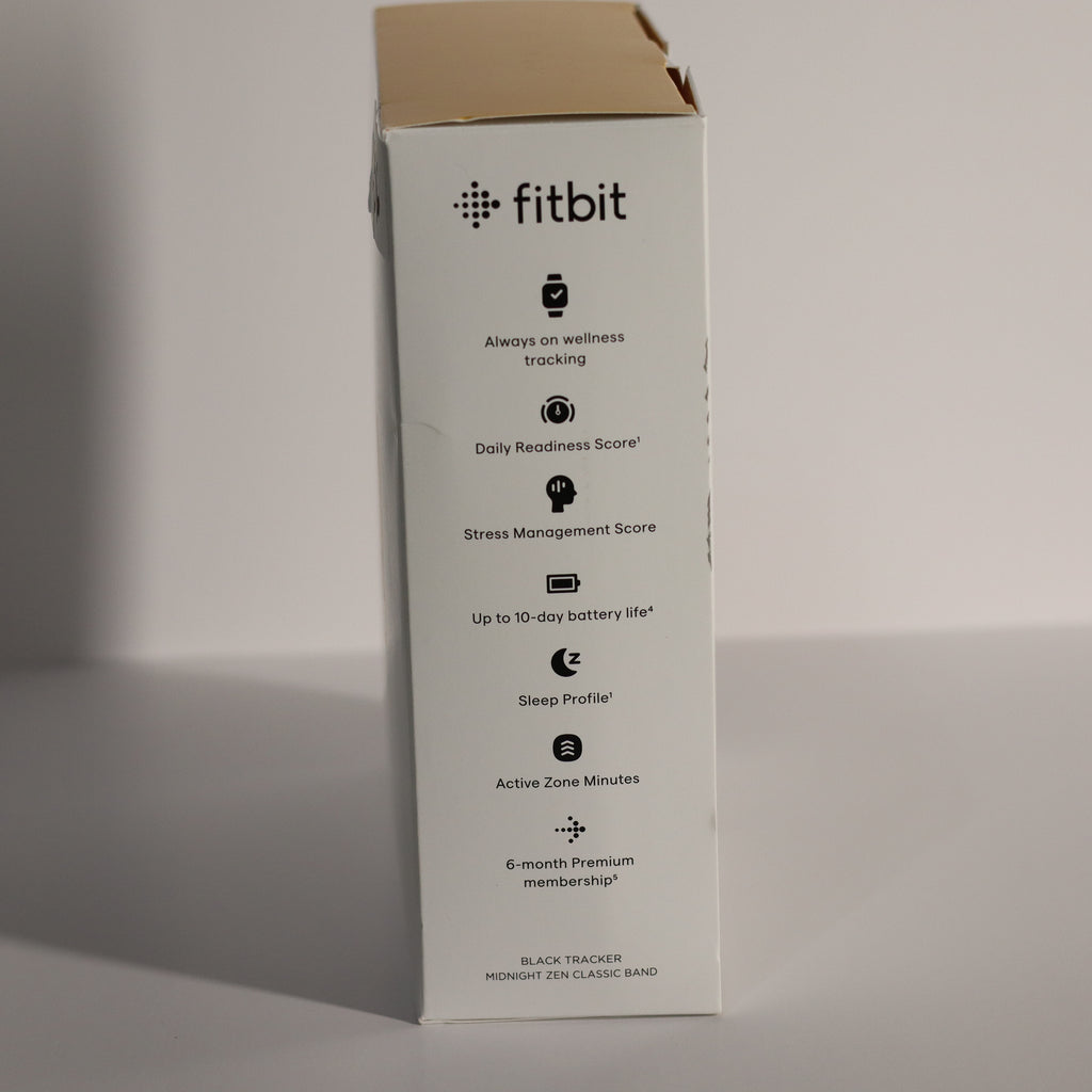 Fitbit product packaging with features listed on a gray background