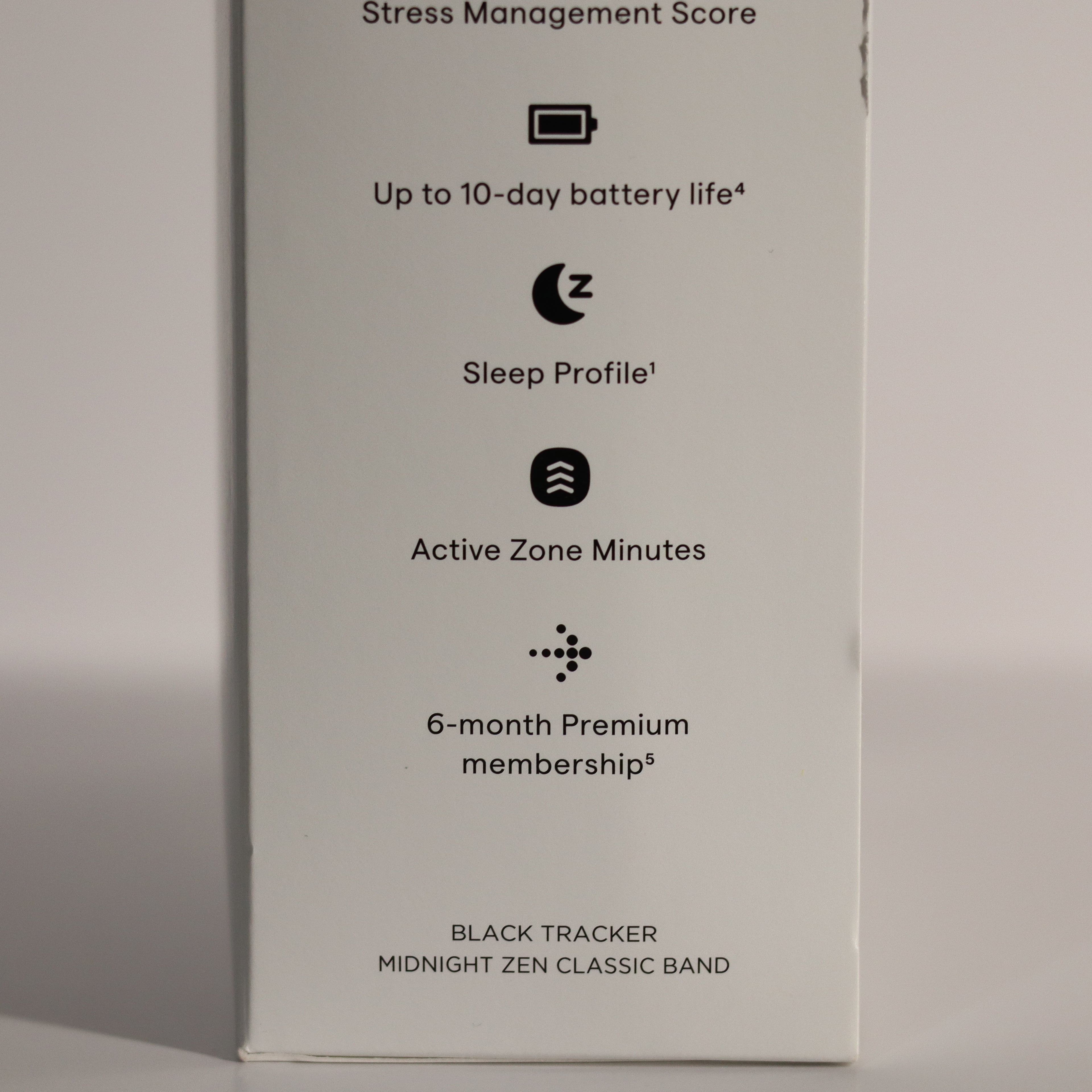 Product packaging with features listed on a gray background