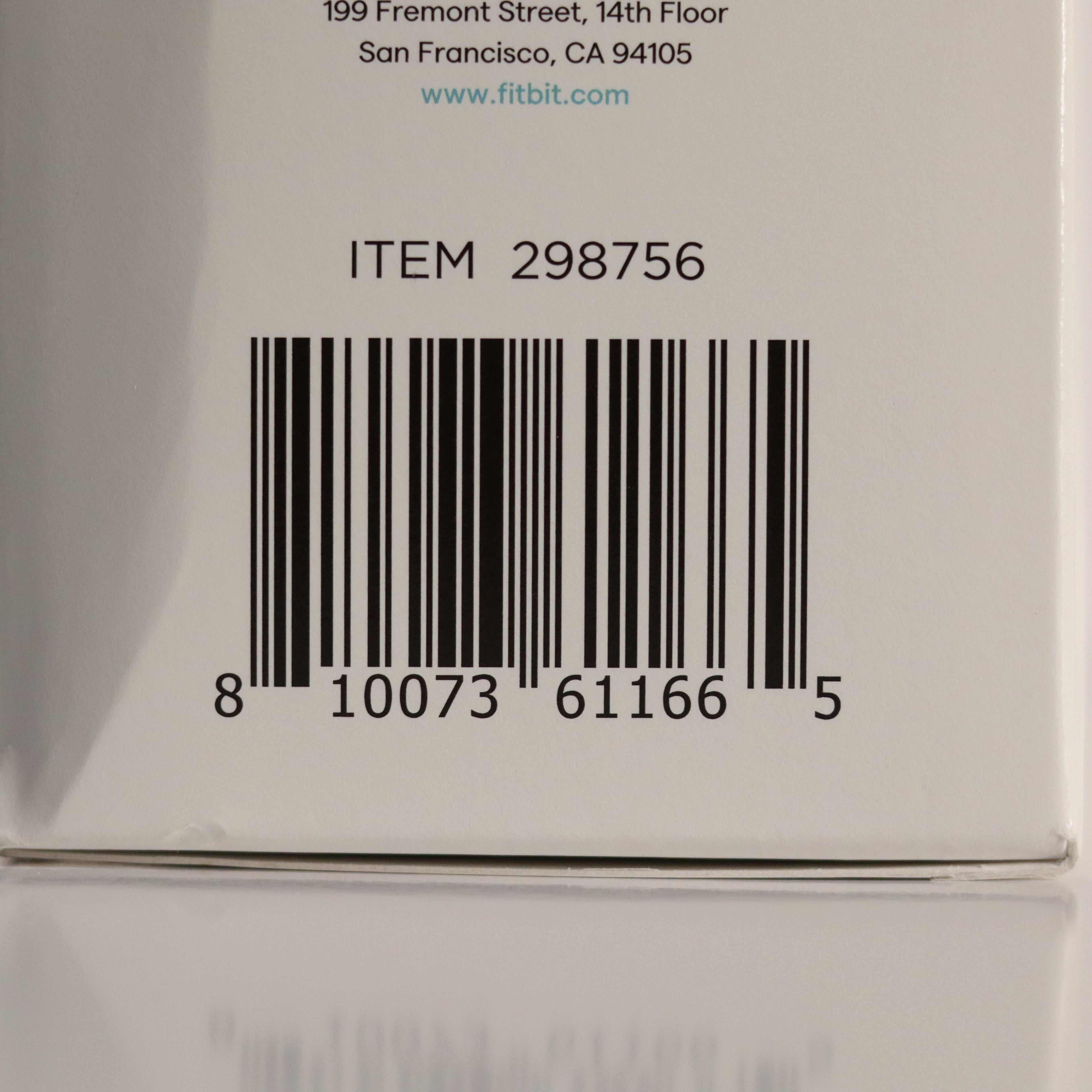 Barcode and text on a Fitbit product packaging
