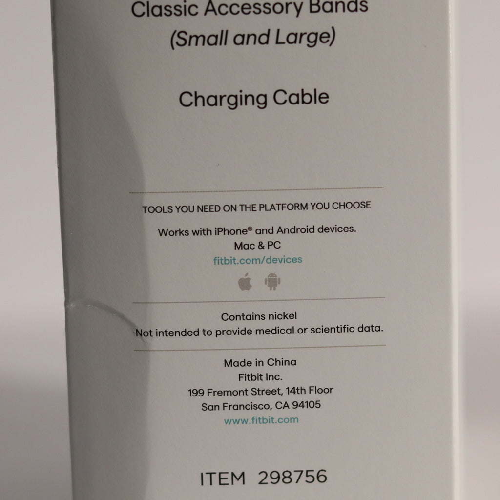 Fitbit accessory packaging with text about charging cable and product details.