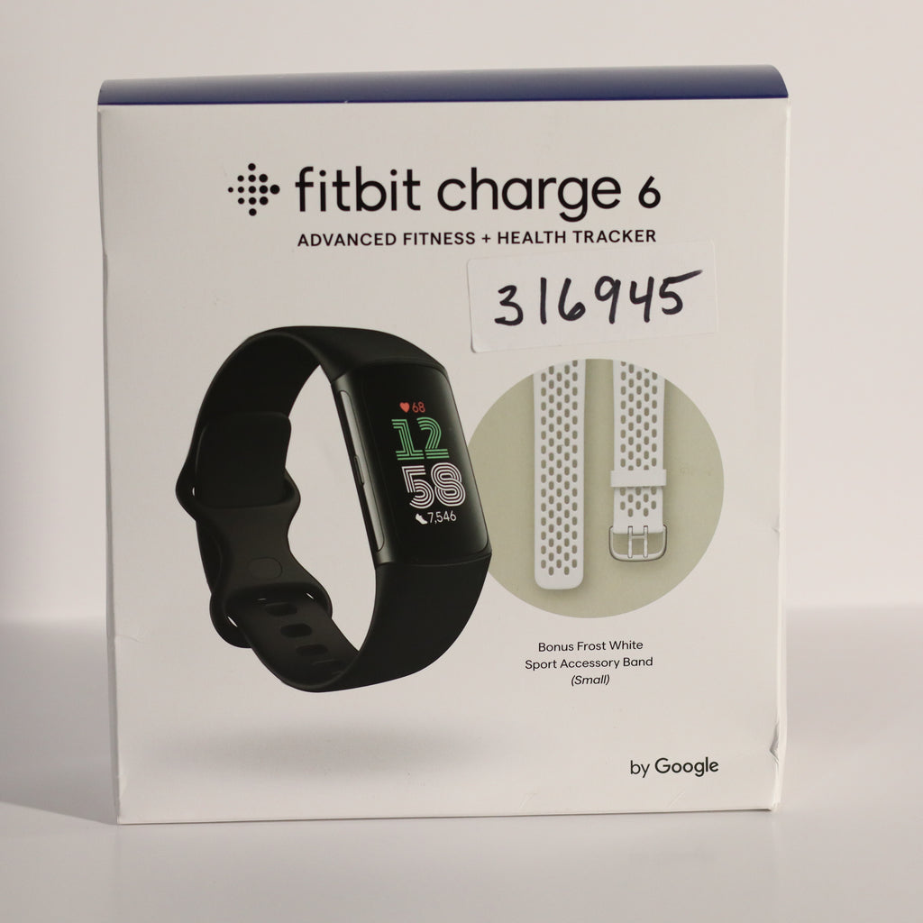 Fitbit Charge 6 packaging with fitness tracker and band on a light gray background