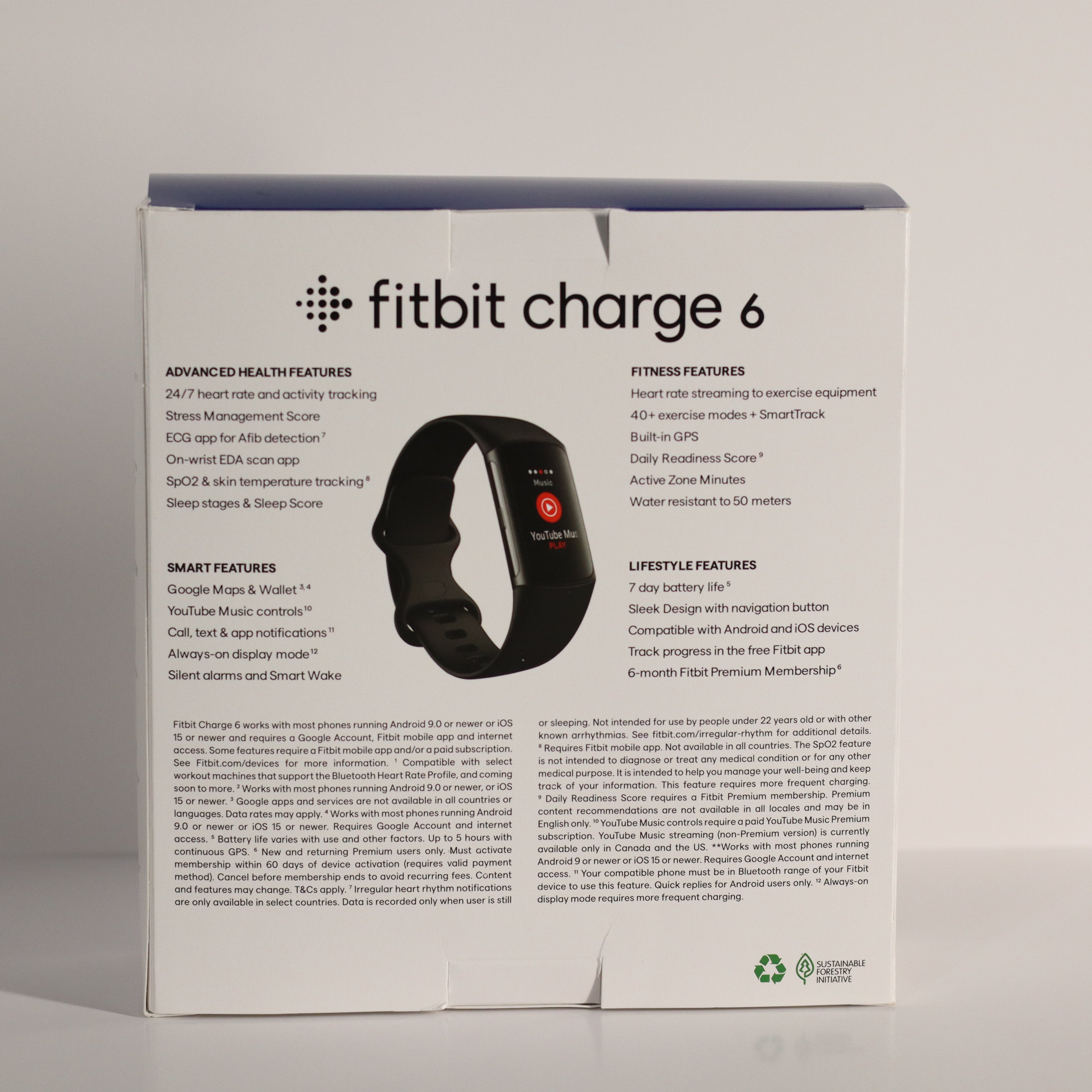 Fitbit Charge 6 packaging box with product details on a gray background