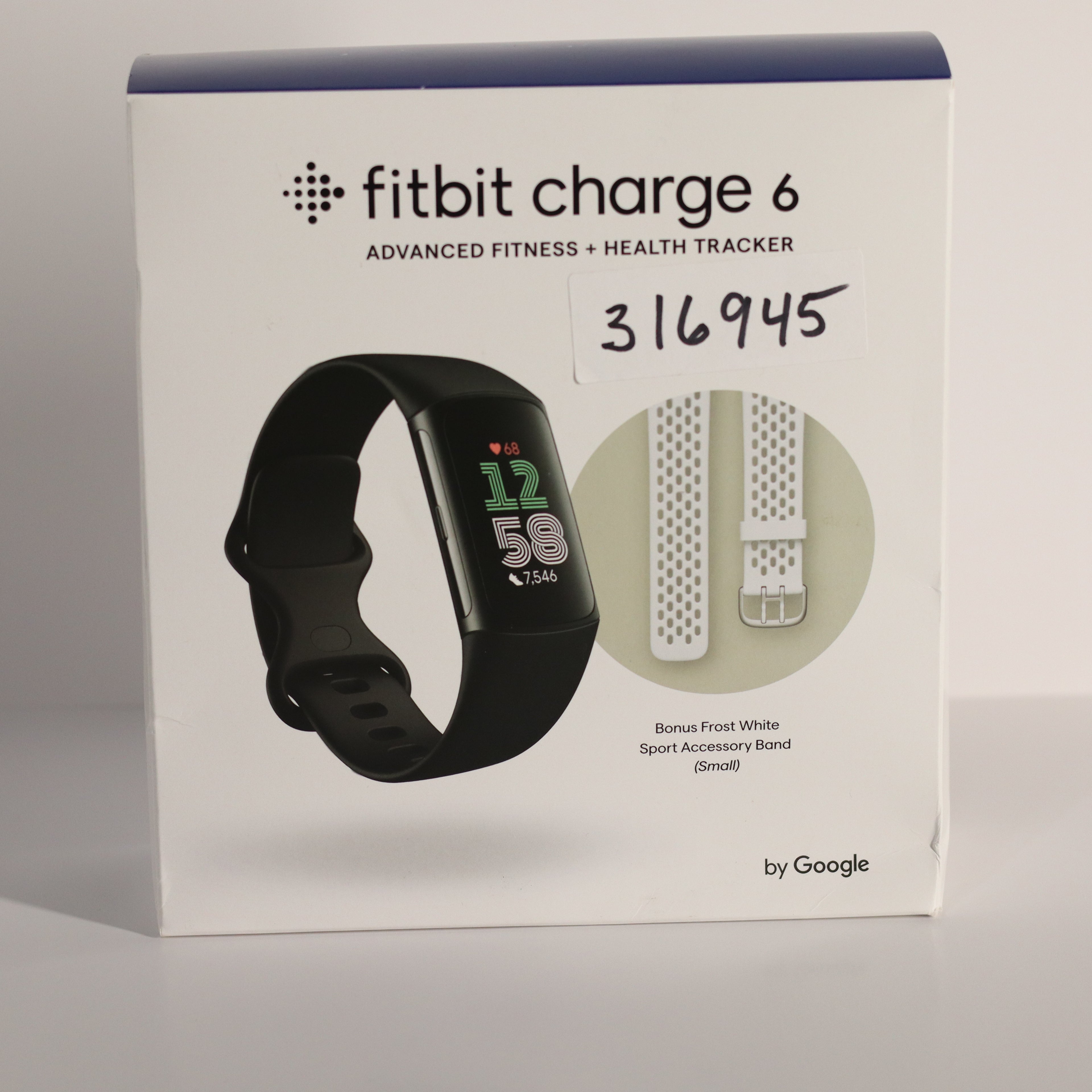 Fitbit Charge 6 packaging with fitness tracker illustration on a white background