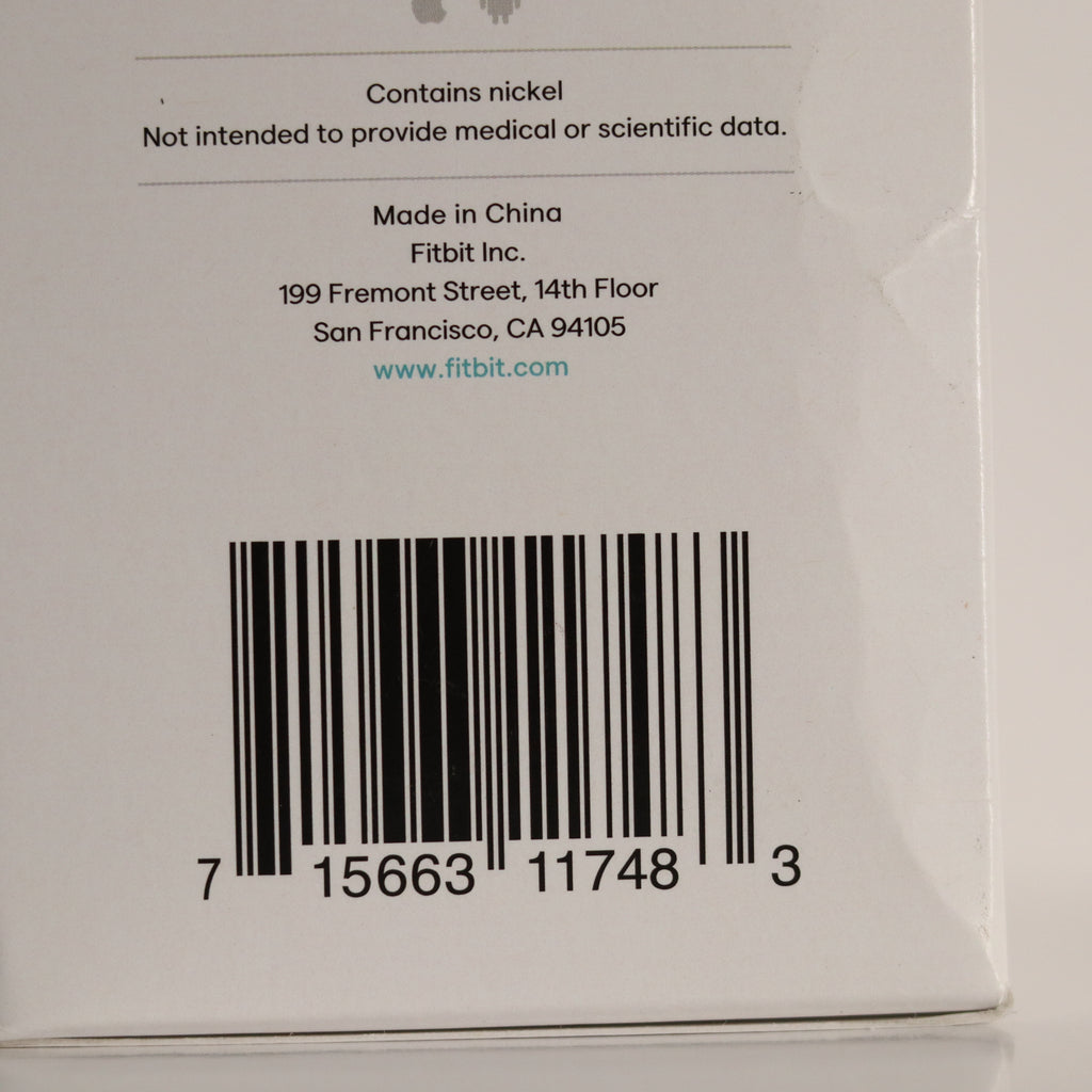 Back of a Fitbit product packaging with bar code and text