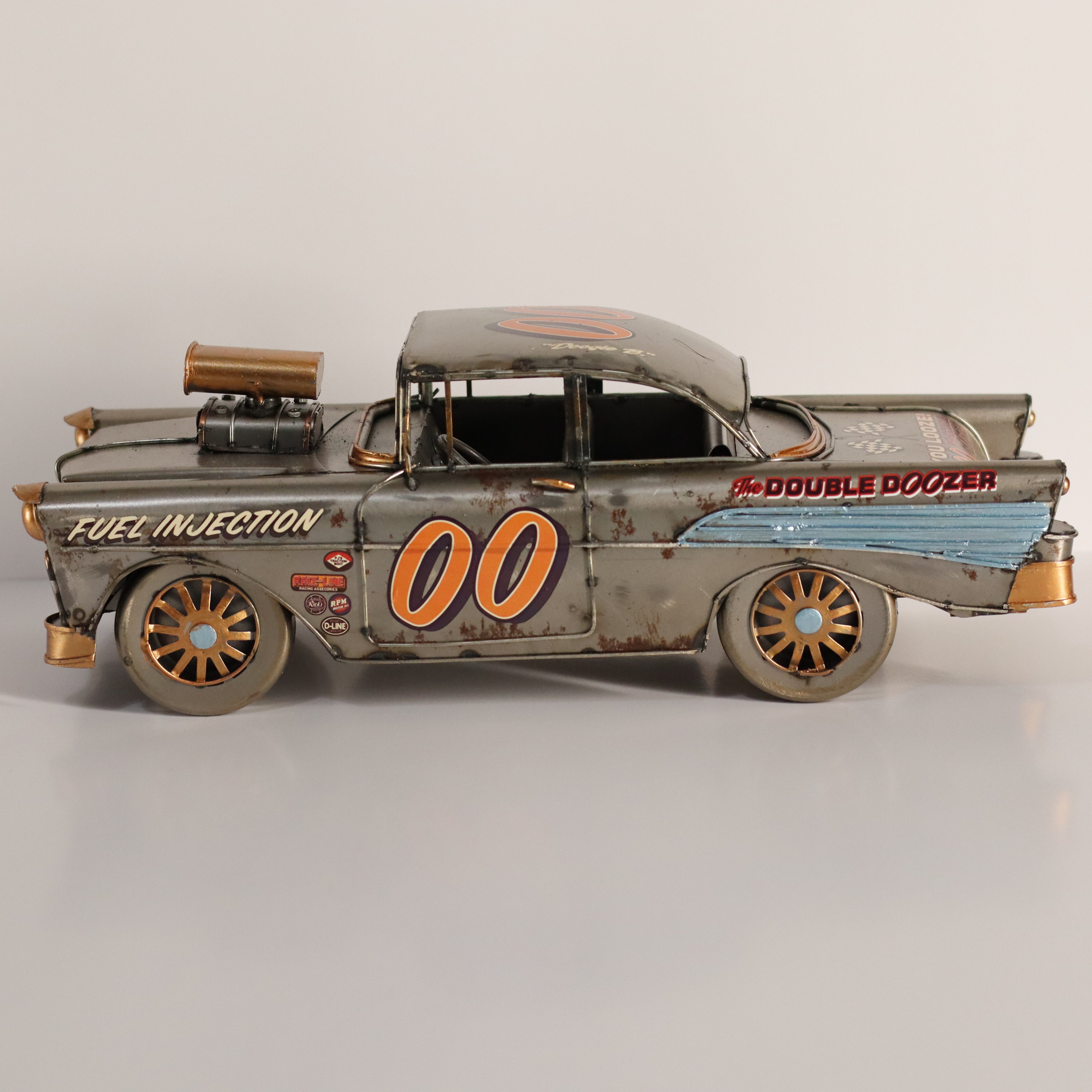 Model of a vintage car with 'Double Doozer' branding on a gray background