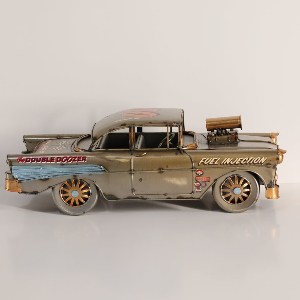Model of a vintage car with 'Fuel Injection' and 'The Double Dozer' text on a light gray background