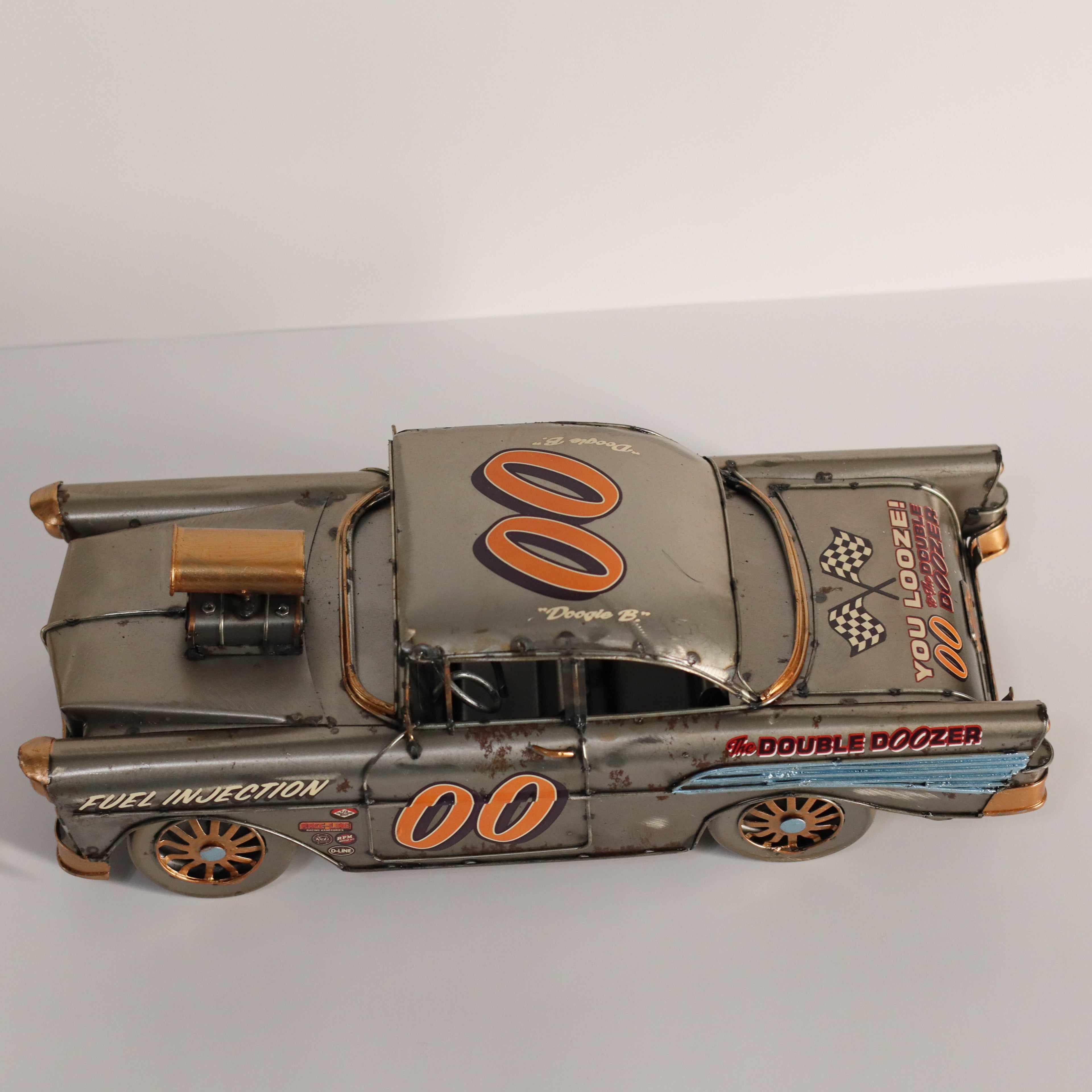 Model of a vintage race car with '00' and 'Double Dozer' branding on a white background