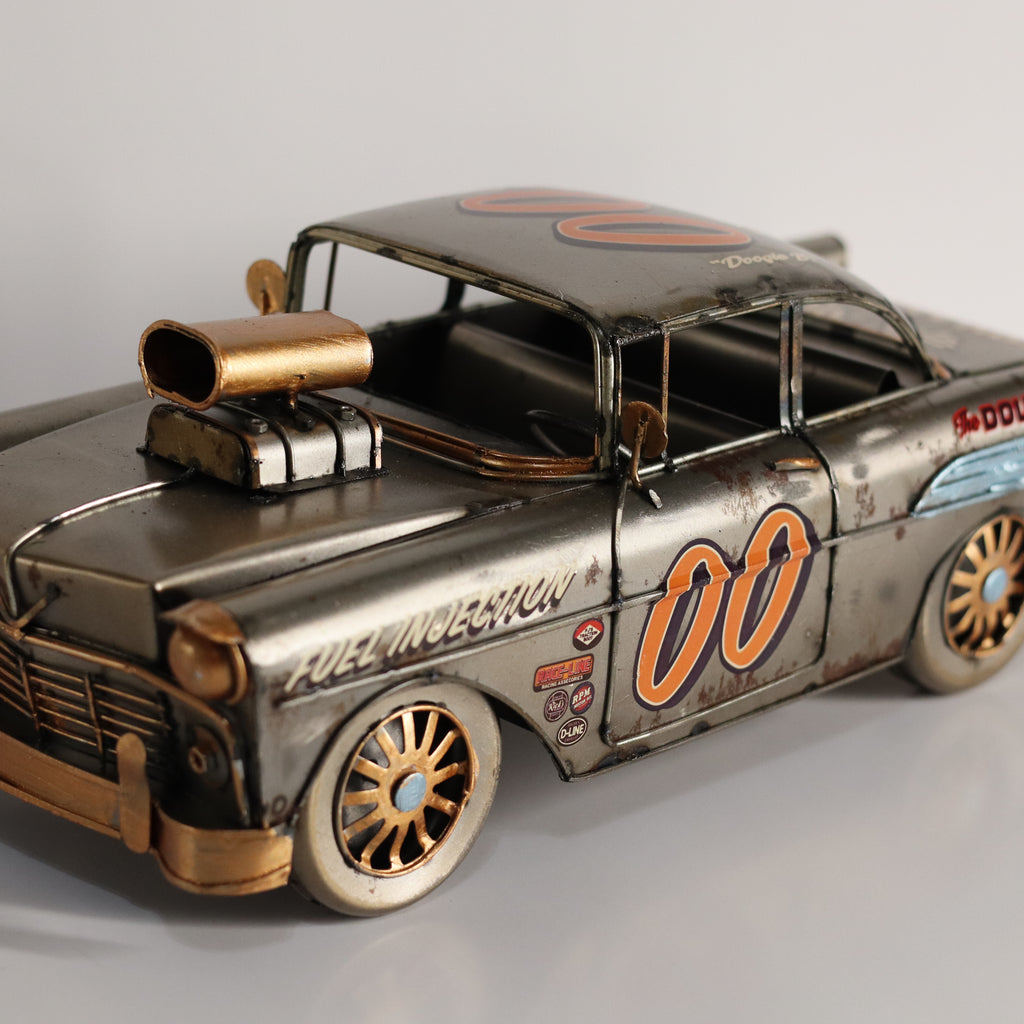 Model car with vintage design and '00' on a gray background
