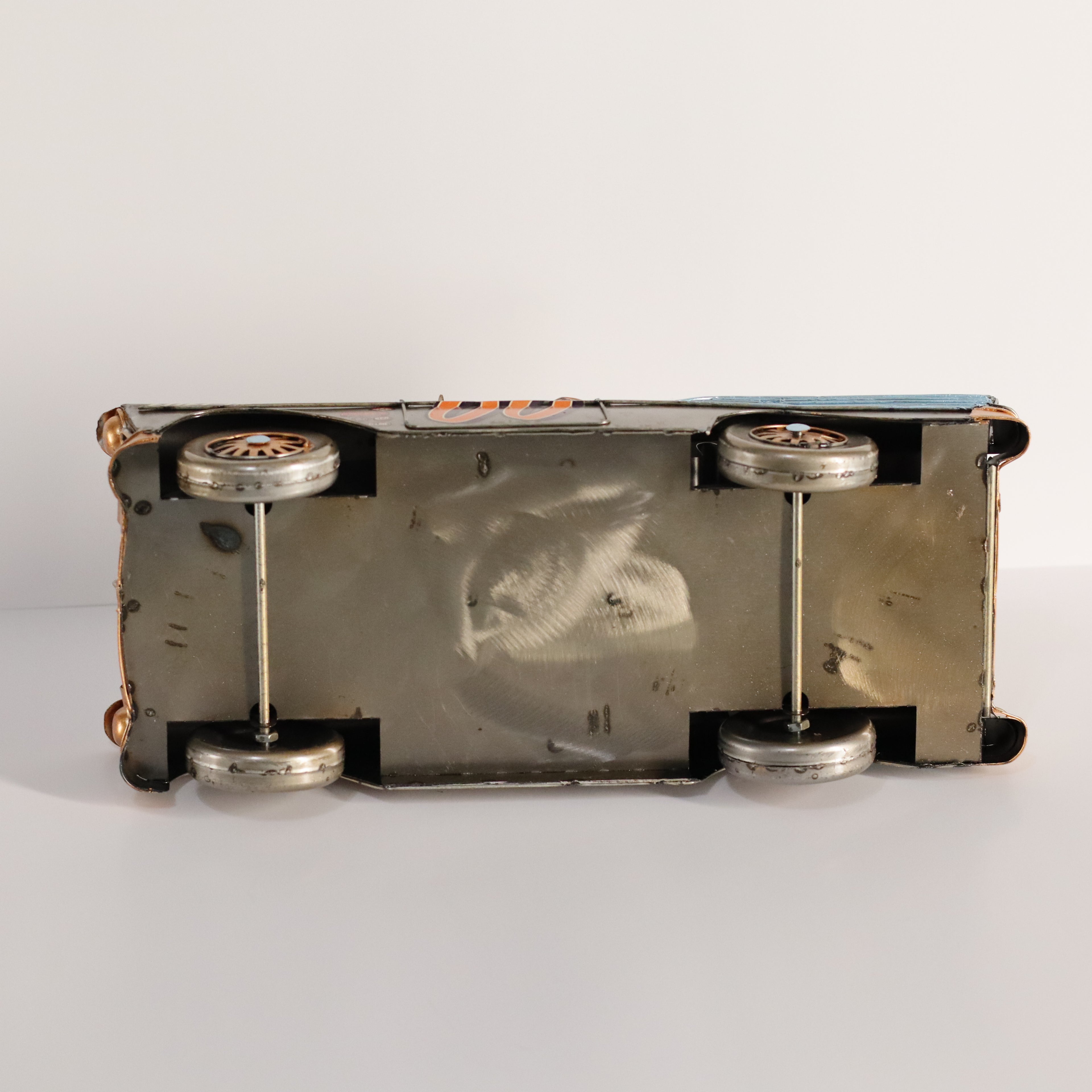 Close-up of a car with visible wear on a white background