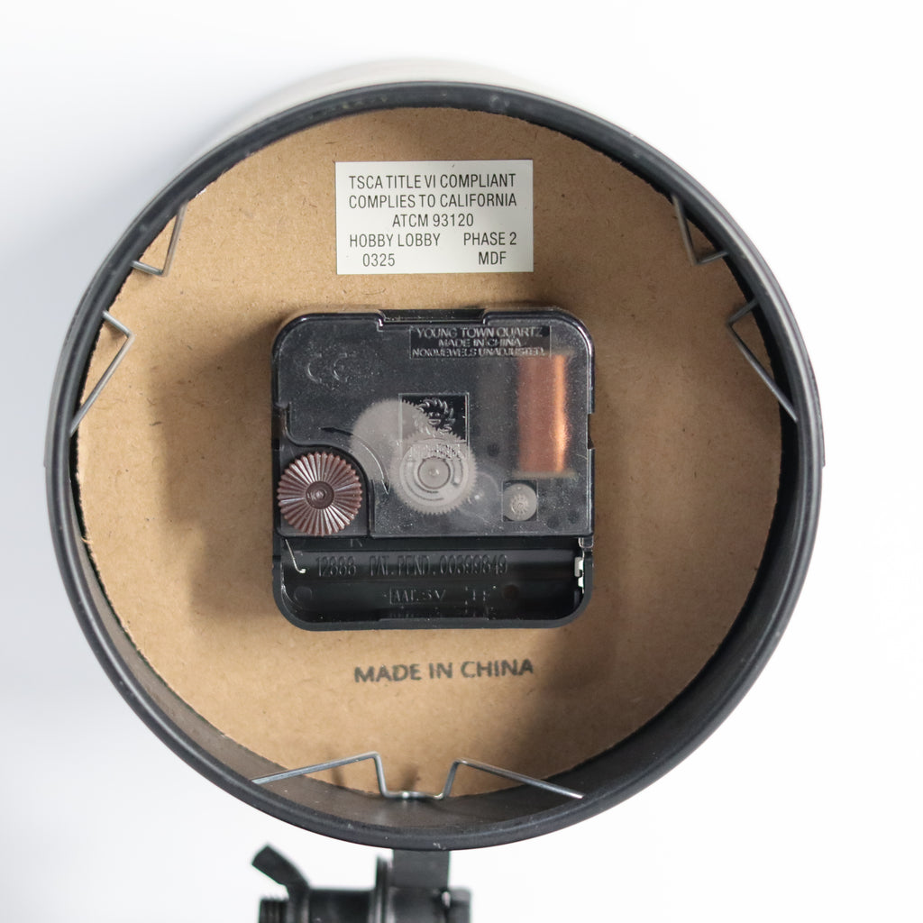 Close-up of a mechanical component with 'Made in China' label on a white background