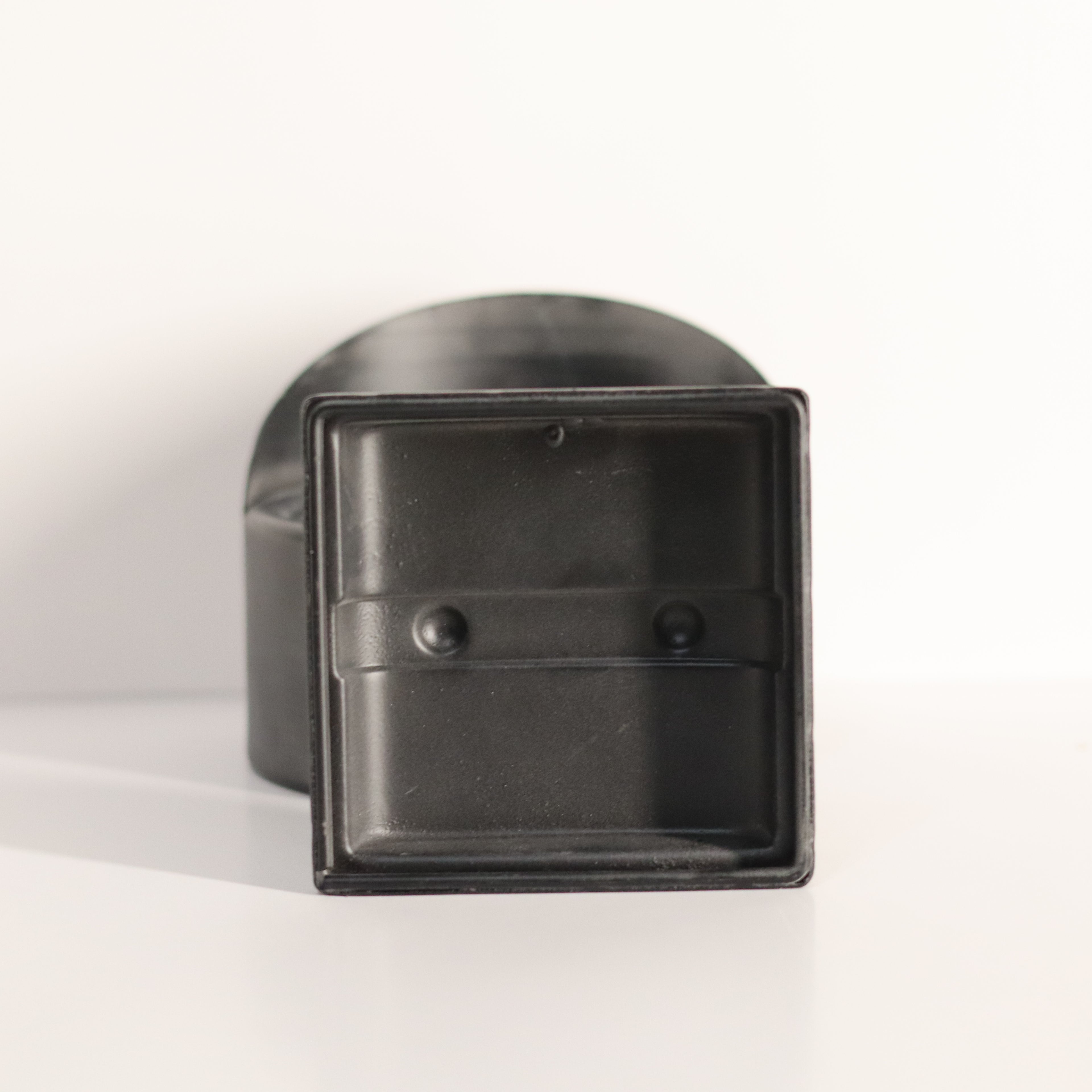 Black metal bracket on a white background