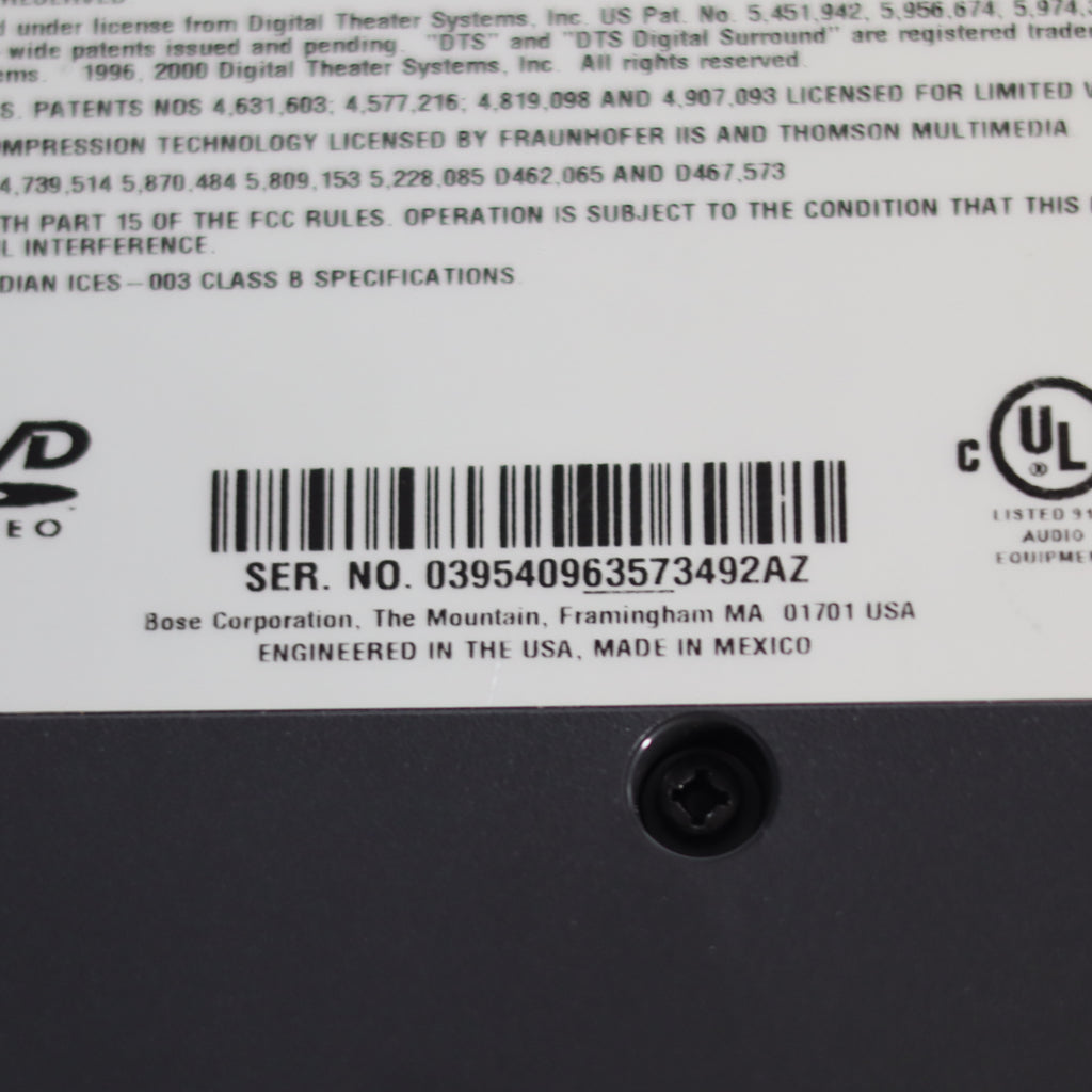 Back of a electronic device with serial number, barcode, and UL logo.