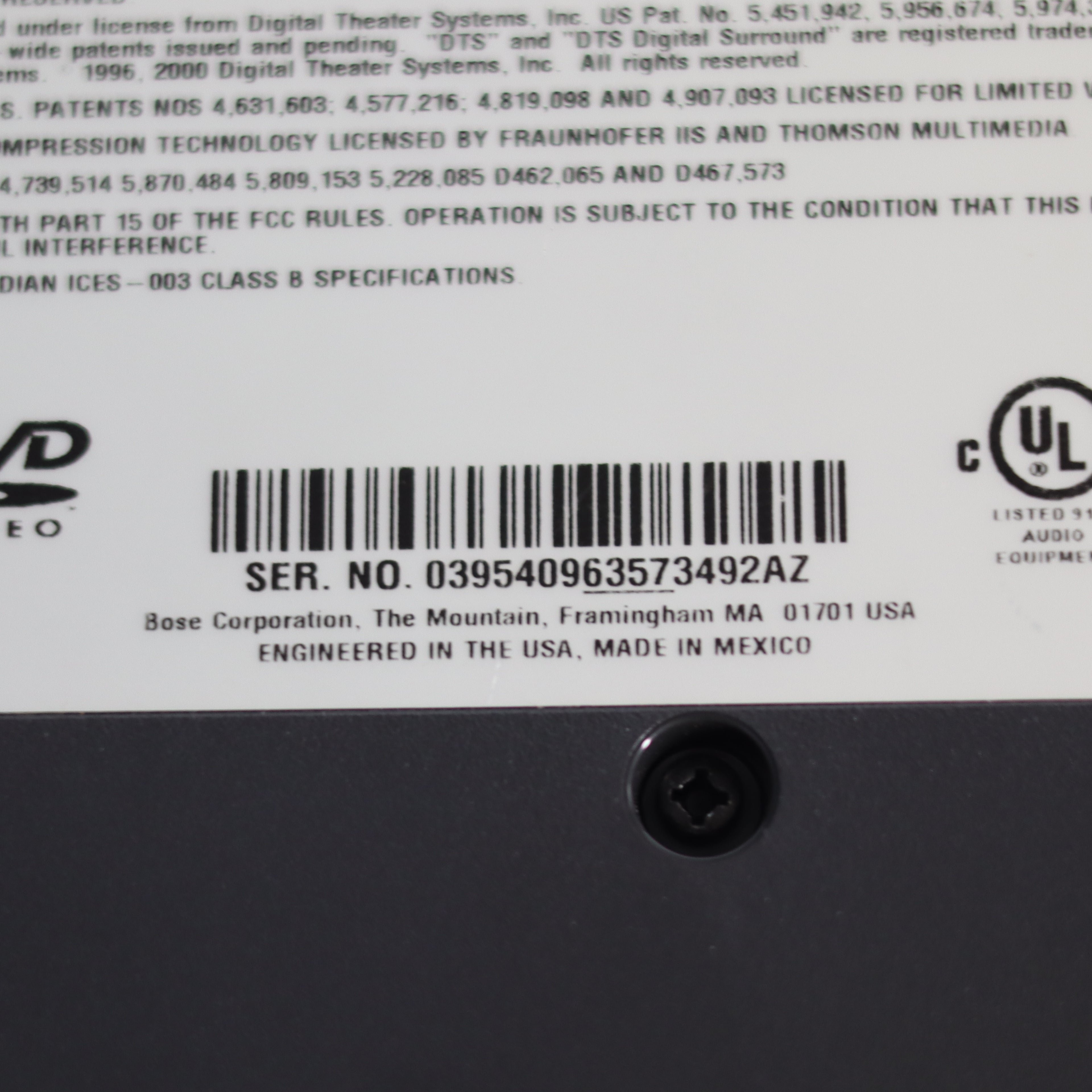 Back of a electronic device with serial number, barcode, and UL logo.