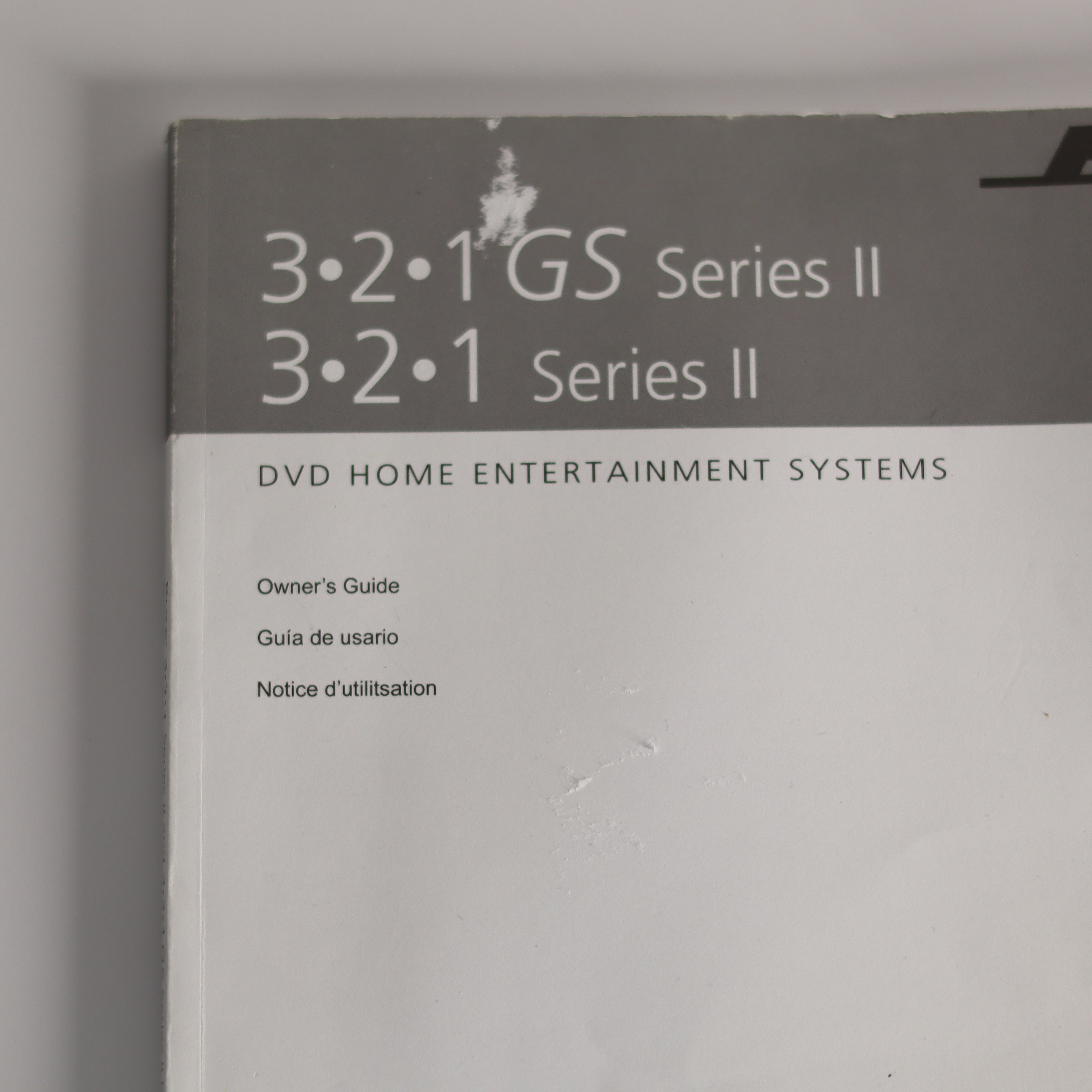 Owner's guide for 321 GS Series II DVD home entertainment system on a gray background