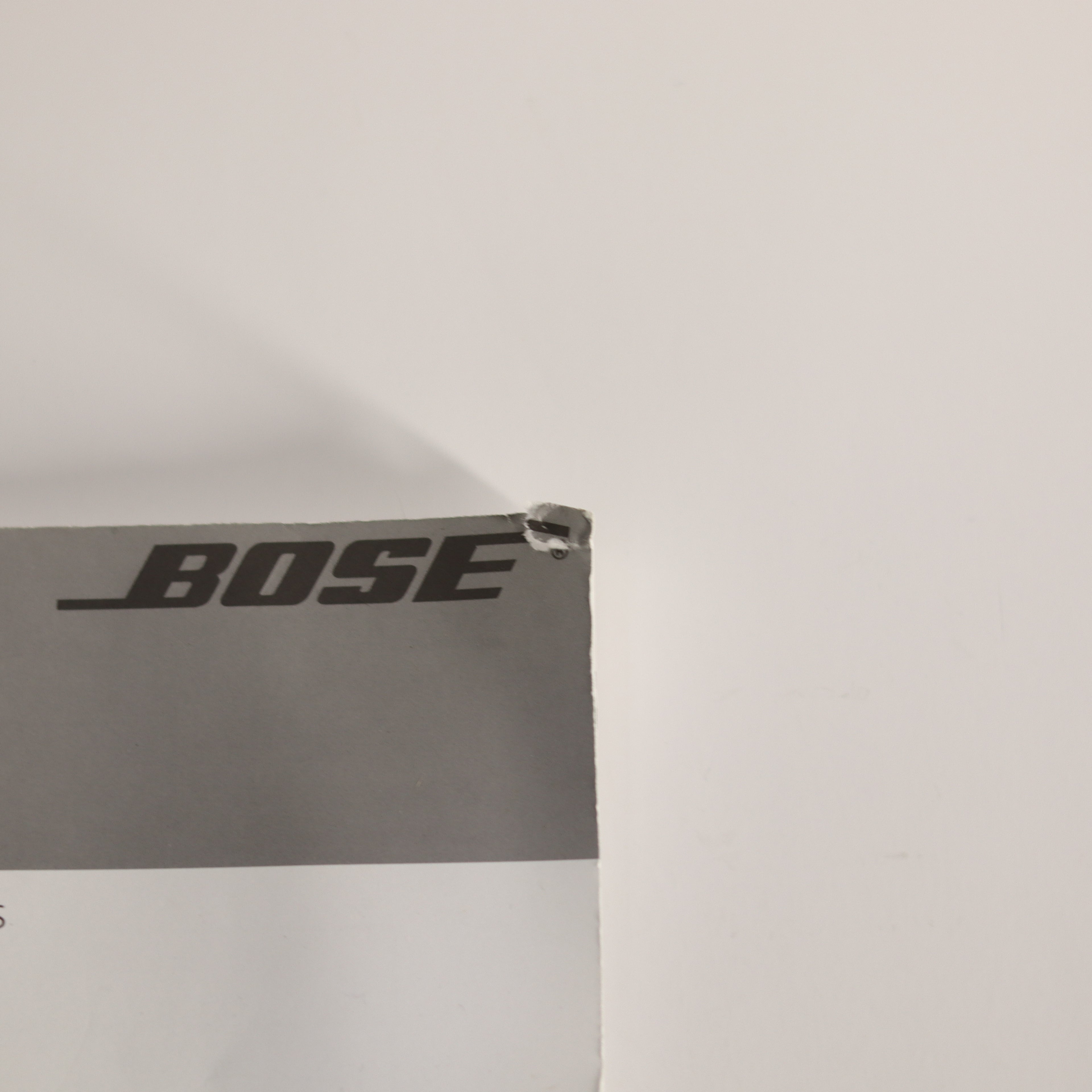 Bose logo on a gray background