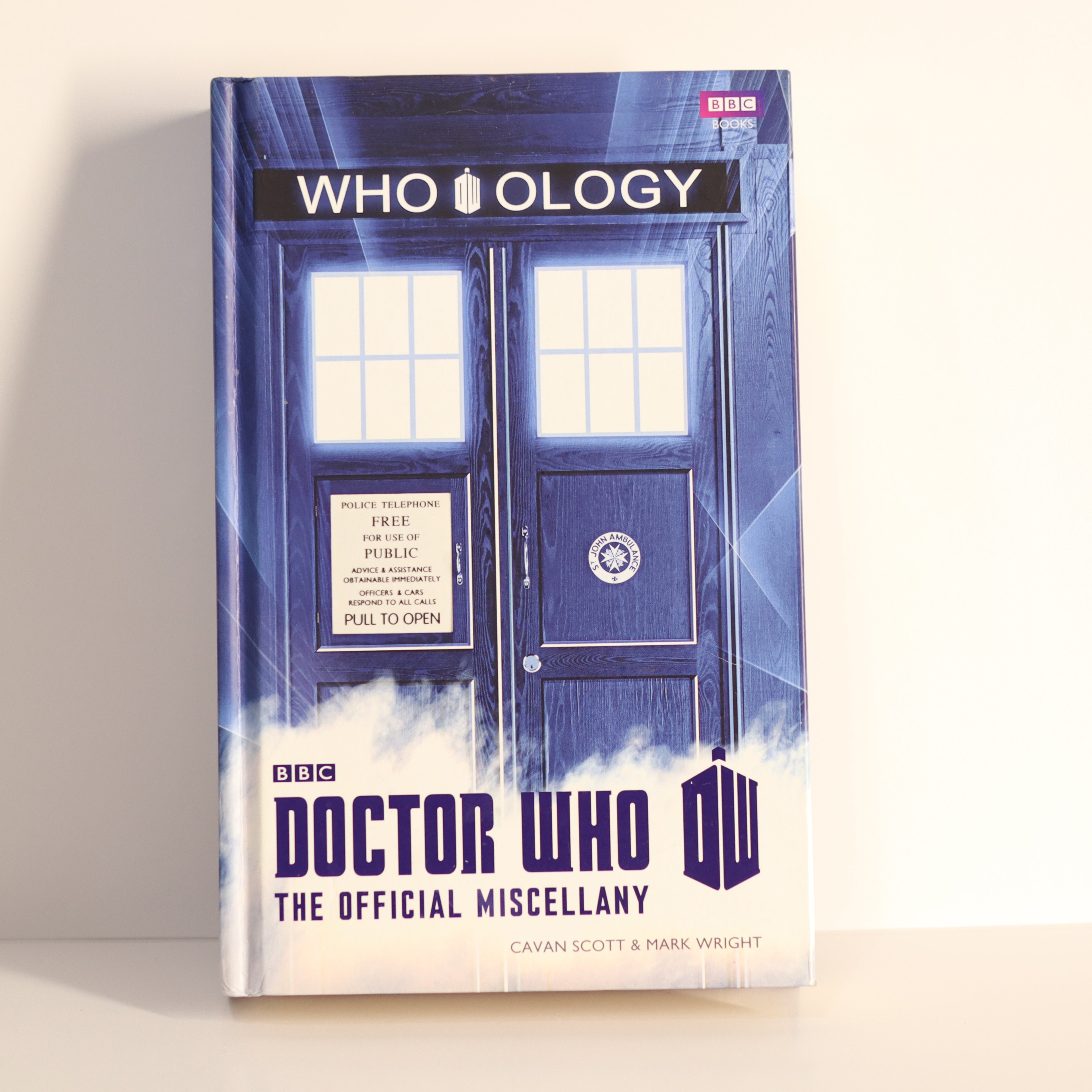 Book titled 'WHO OLOGY' by BBC Doctor Who on a light background