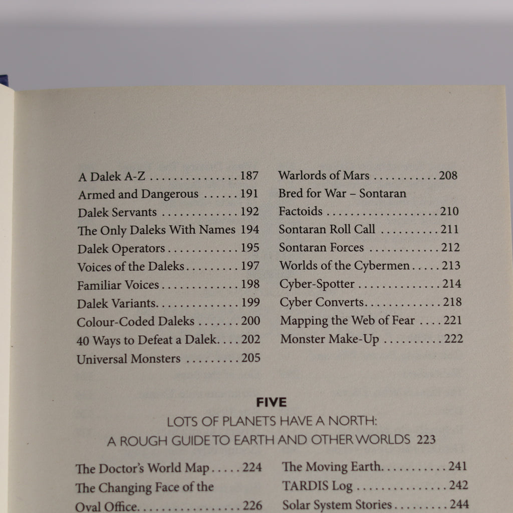 Table of contents page from a book with text and numbers on a gray background