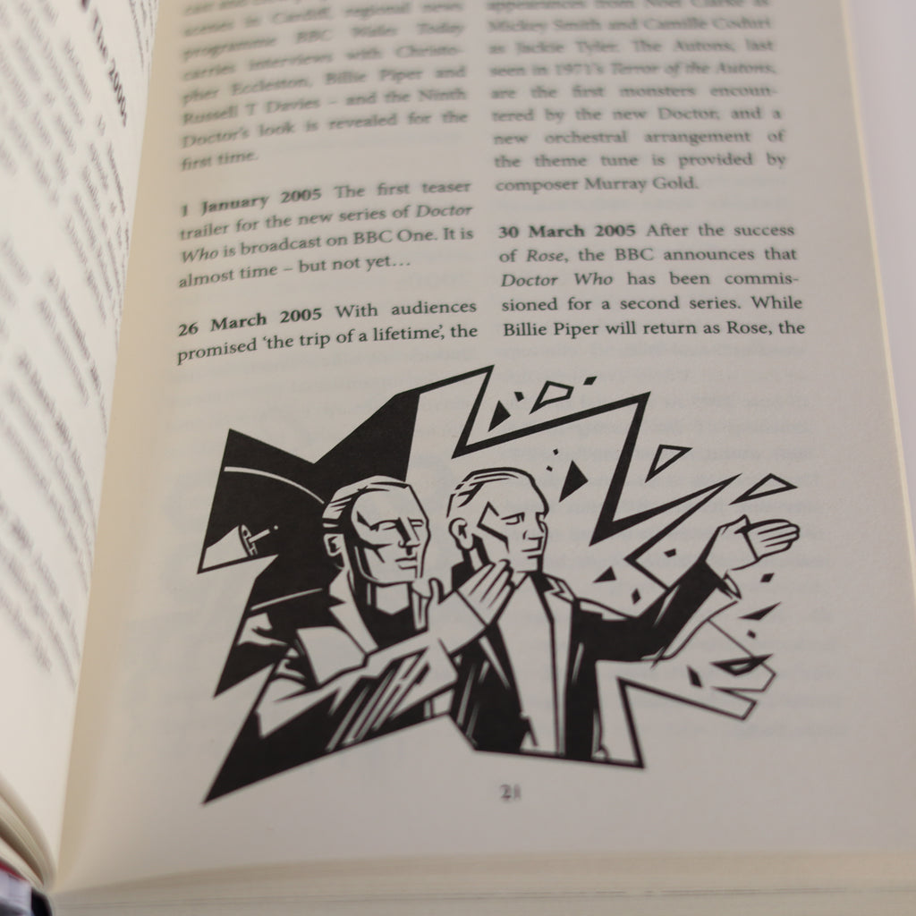 Open book with black and white illustration of two figures on a white background