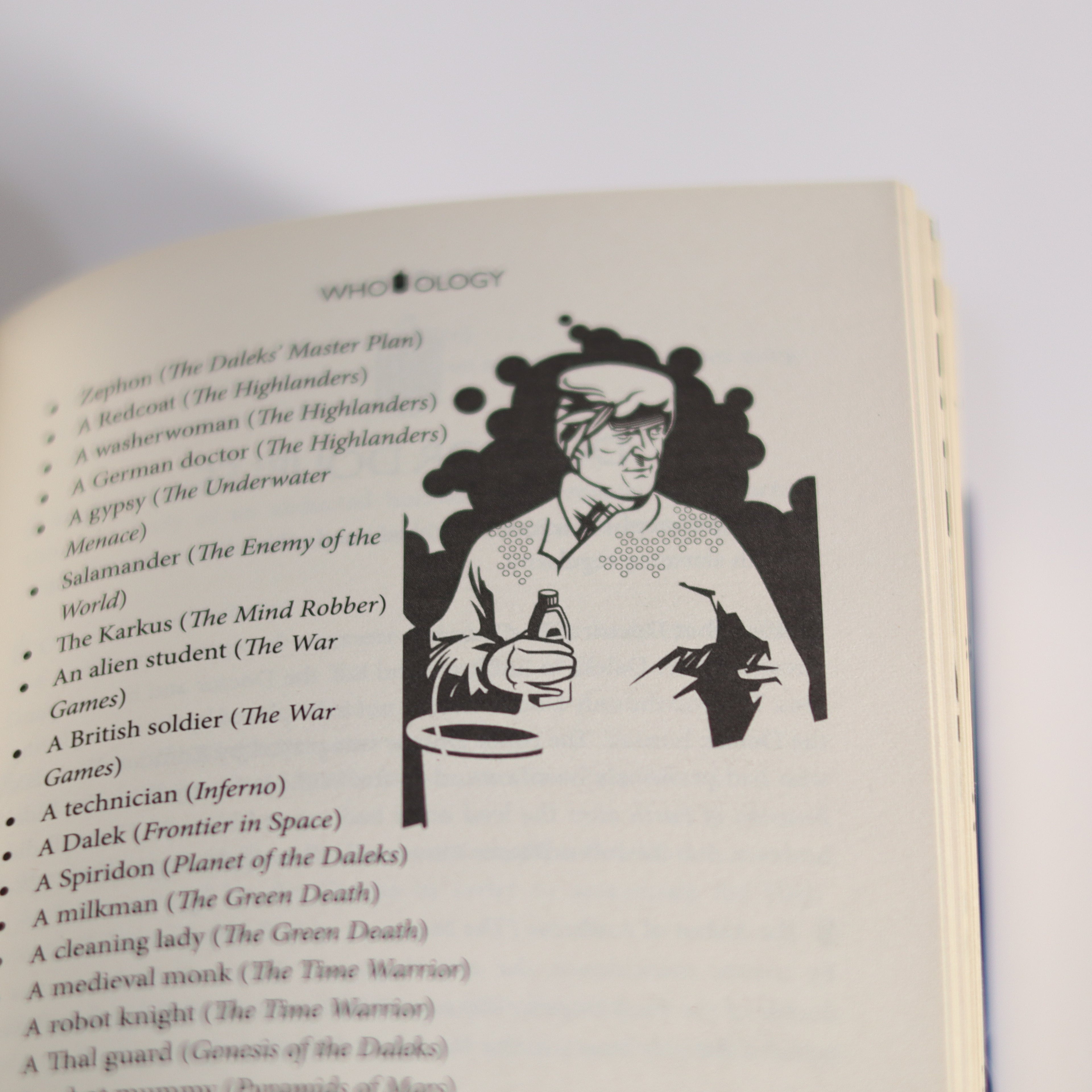 Book page with illustration of a character and text on a white background