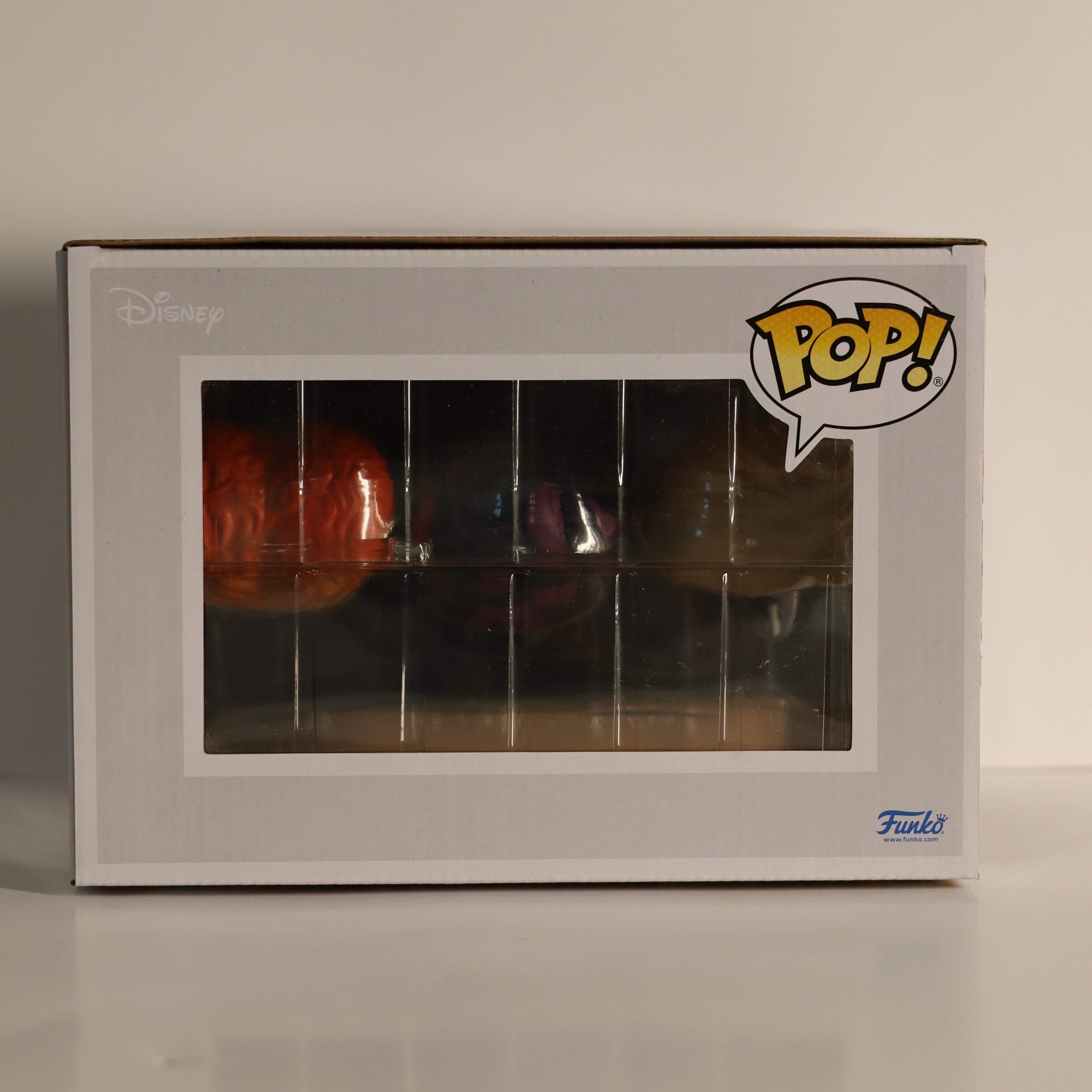 Funko Pop! box with a clear window showing a figure inside, on a neutral background