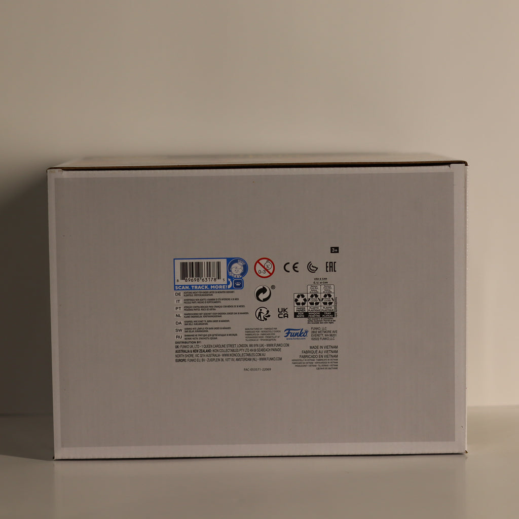 Back view of a gray product box with labels and symbols on a beige background