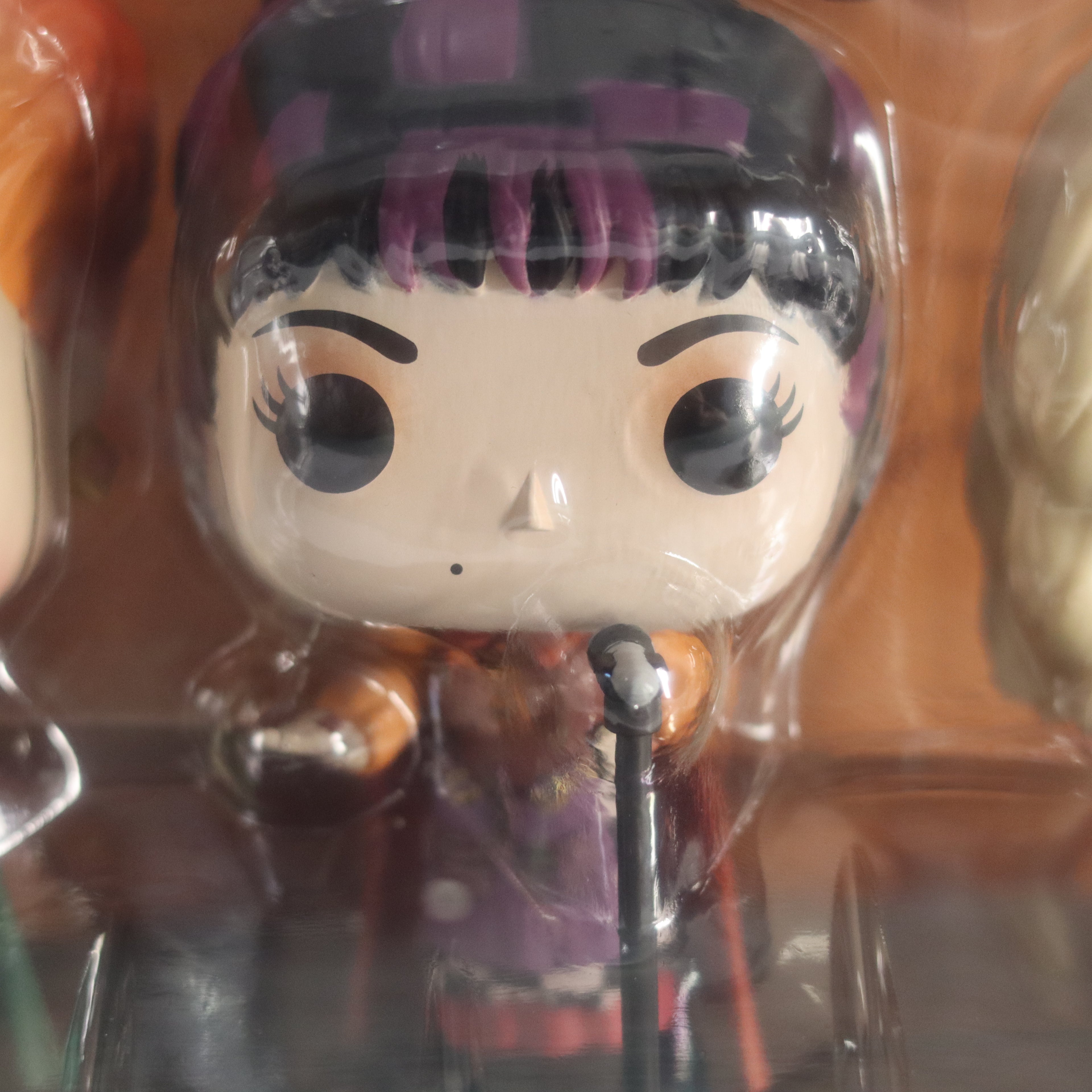 Funko Pop! vinyl figure in packaging with a microphone