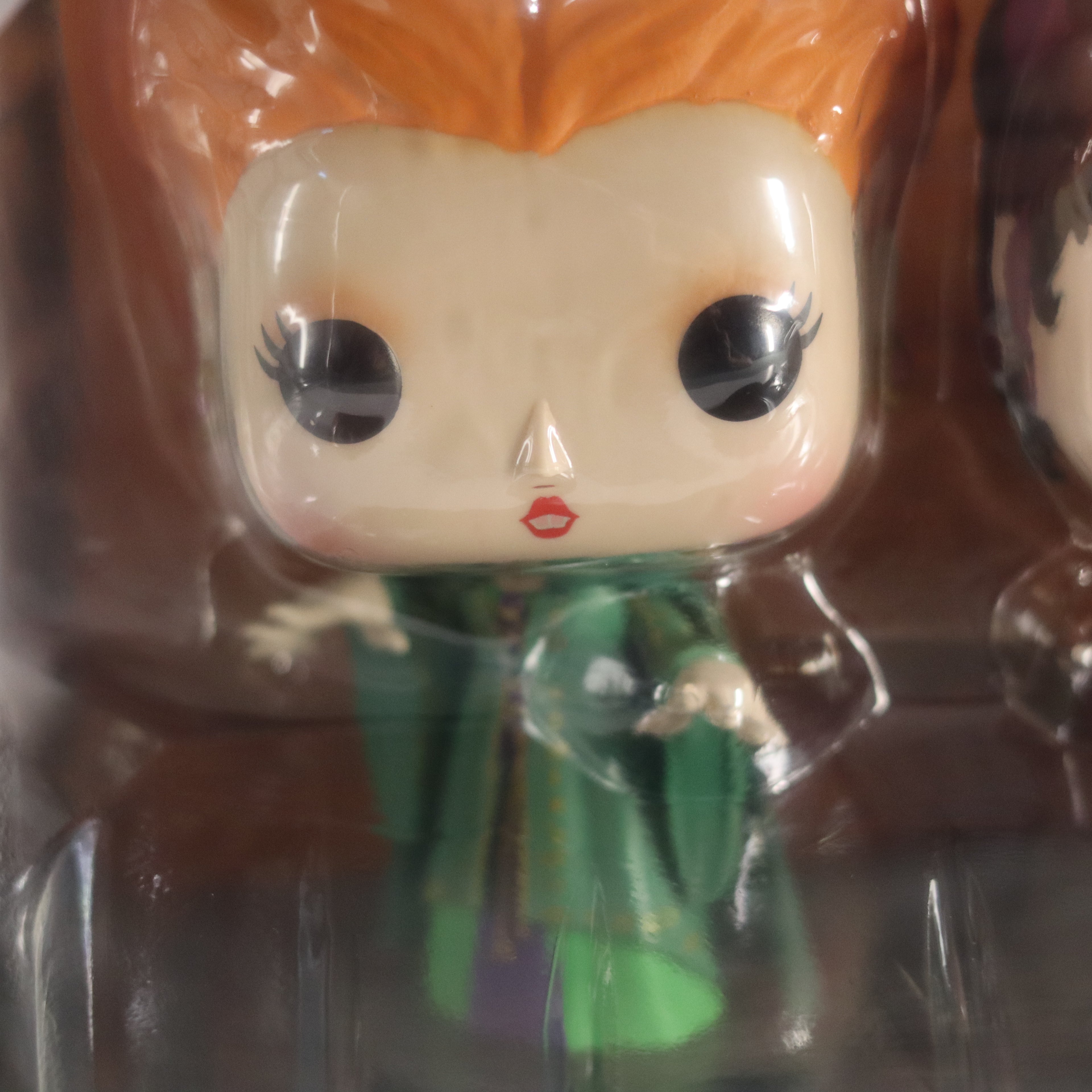 Funko Pop! vinyl figure in packaging with a character wearing a green outfit.