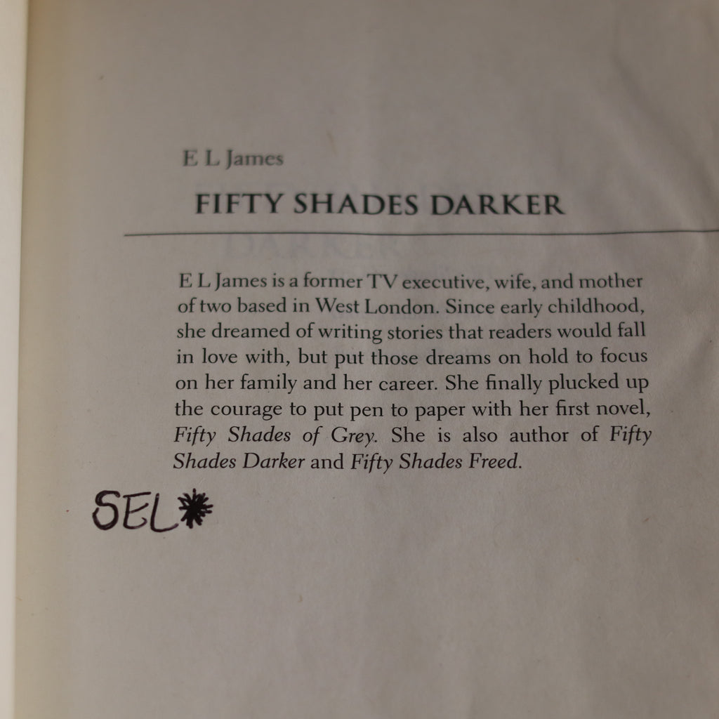 Book page with text about E.L. James and 'Fifty Shades Darker'.