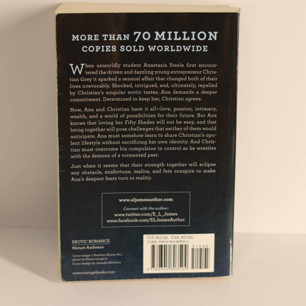 Back cover of a book with text and branding on a beige background