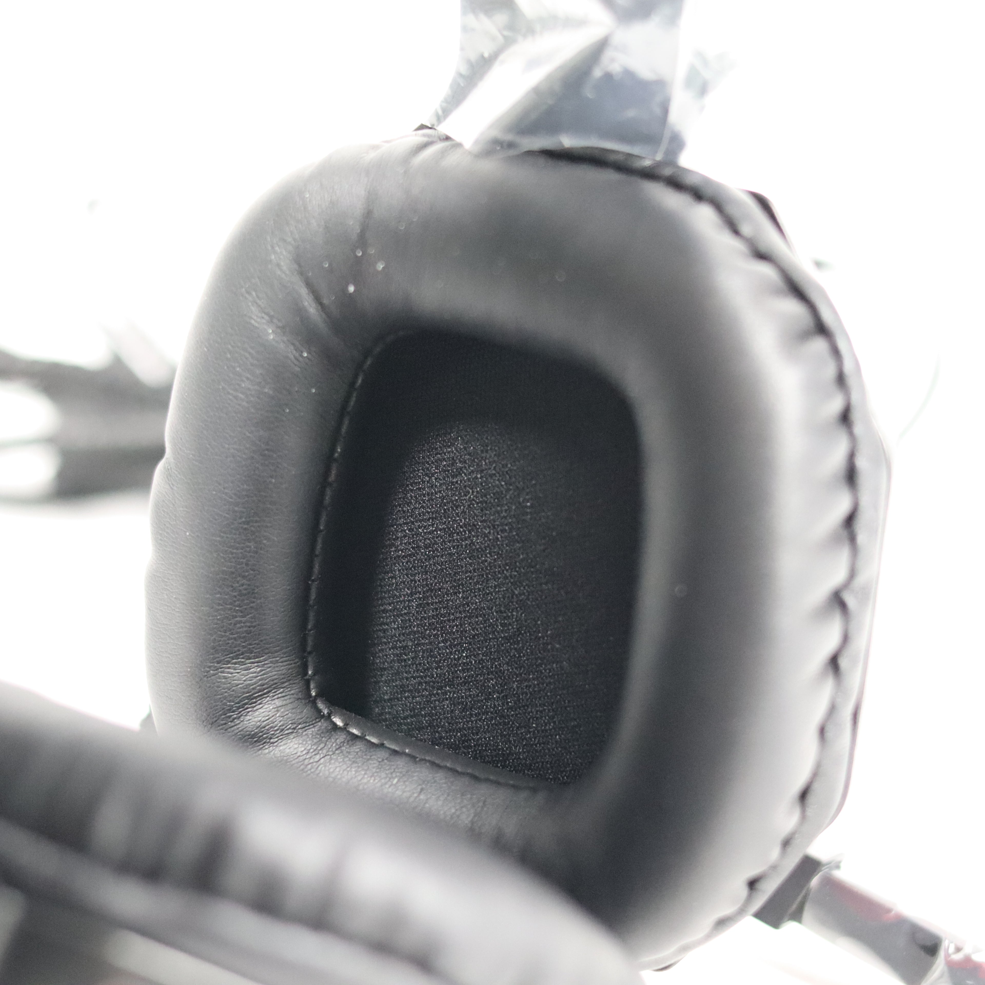 Close-up of a gray earpad on a blurred background