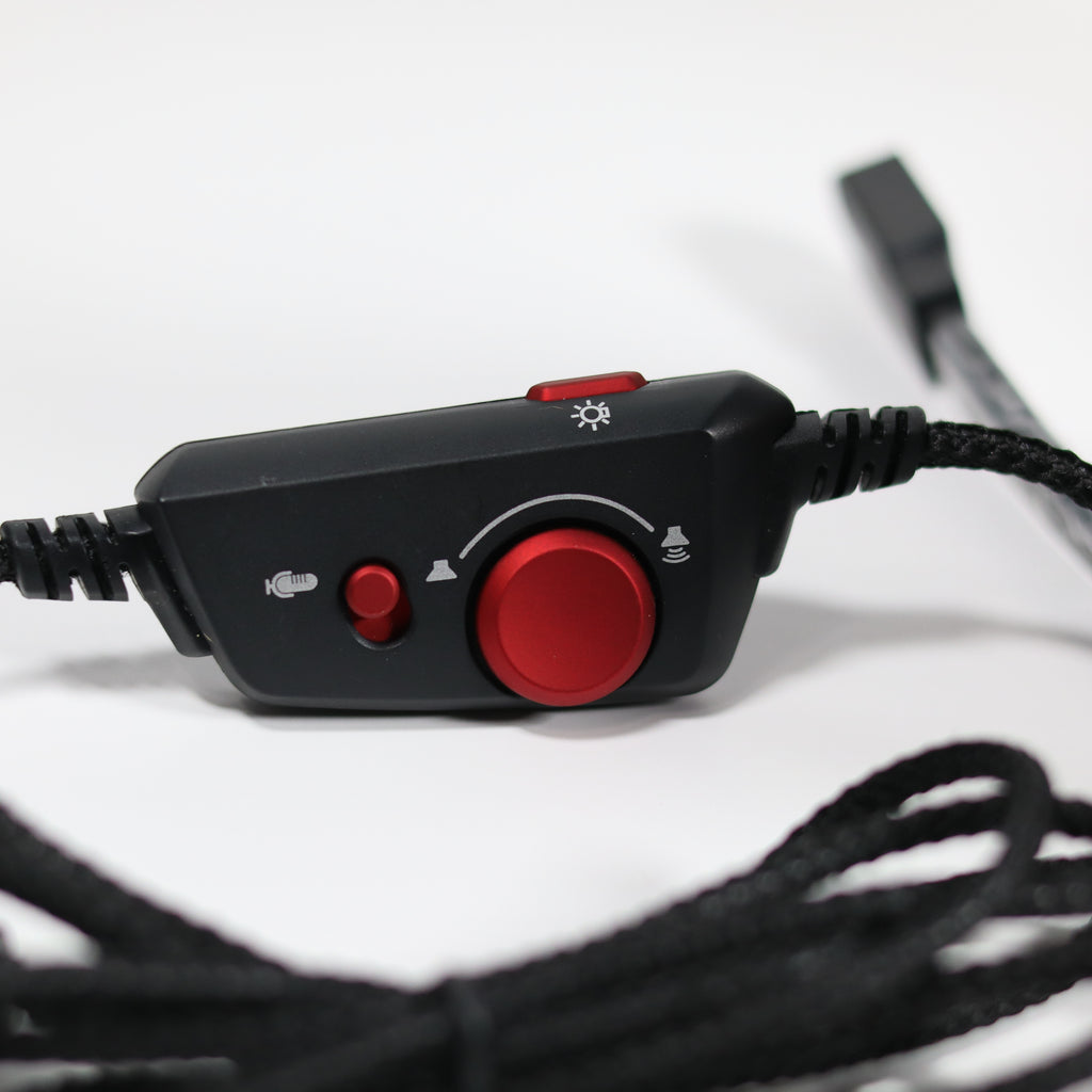 Black and red control panel with buttons on a white background