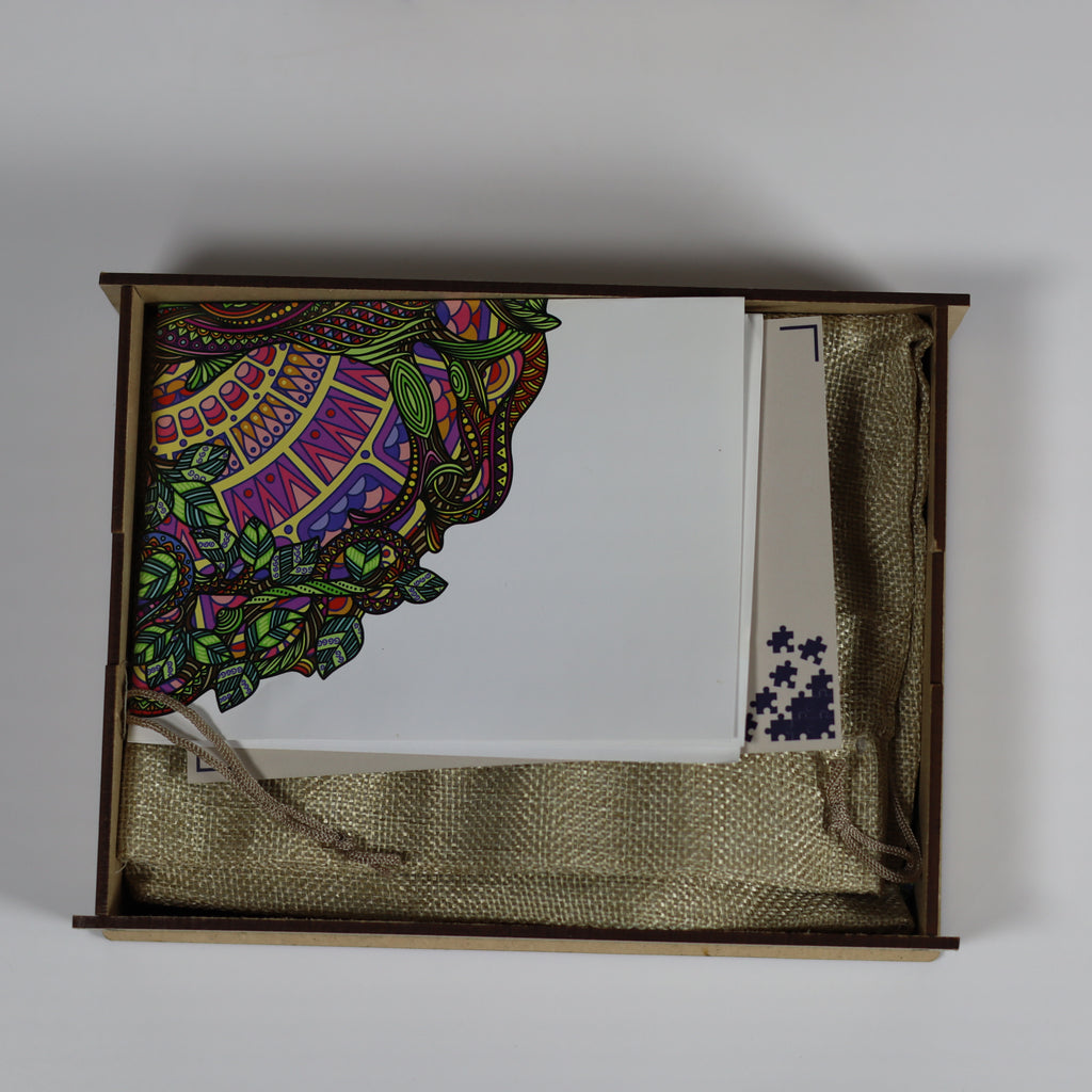 Decorative box with colorful mandala design on a white background