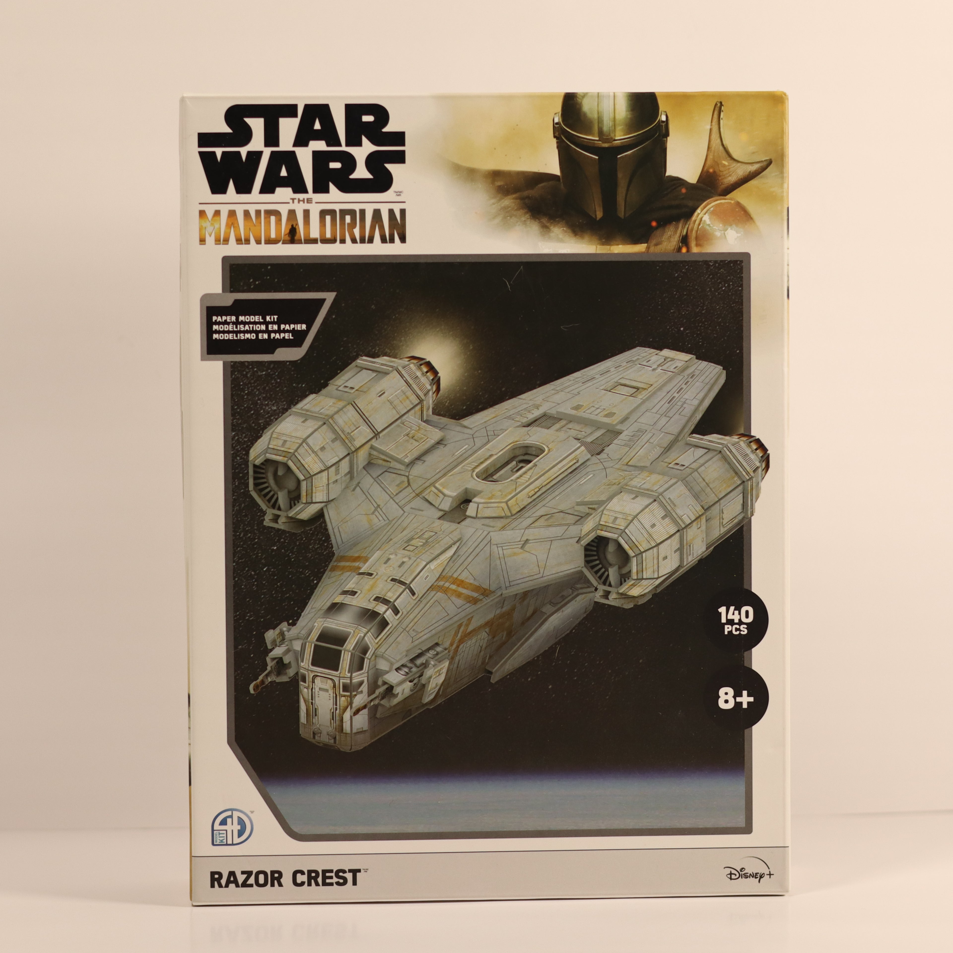 Star Wars The Mandalorian Razor Crest model kit packaging on a beige background