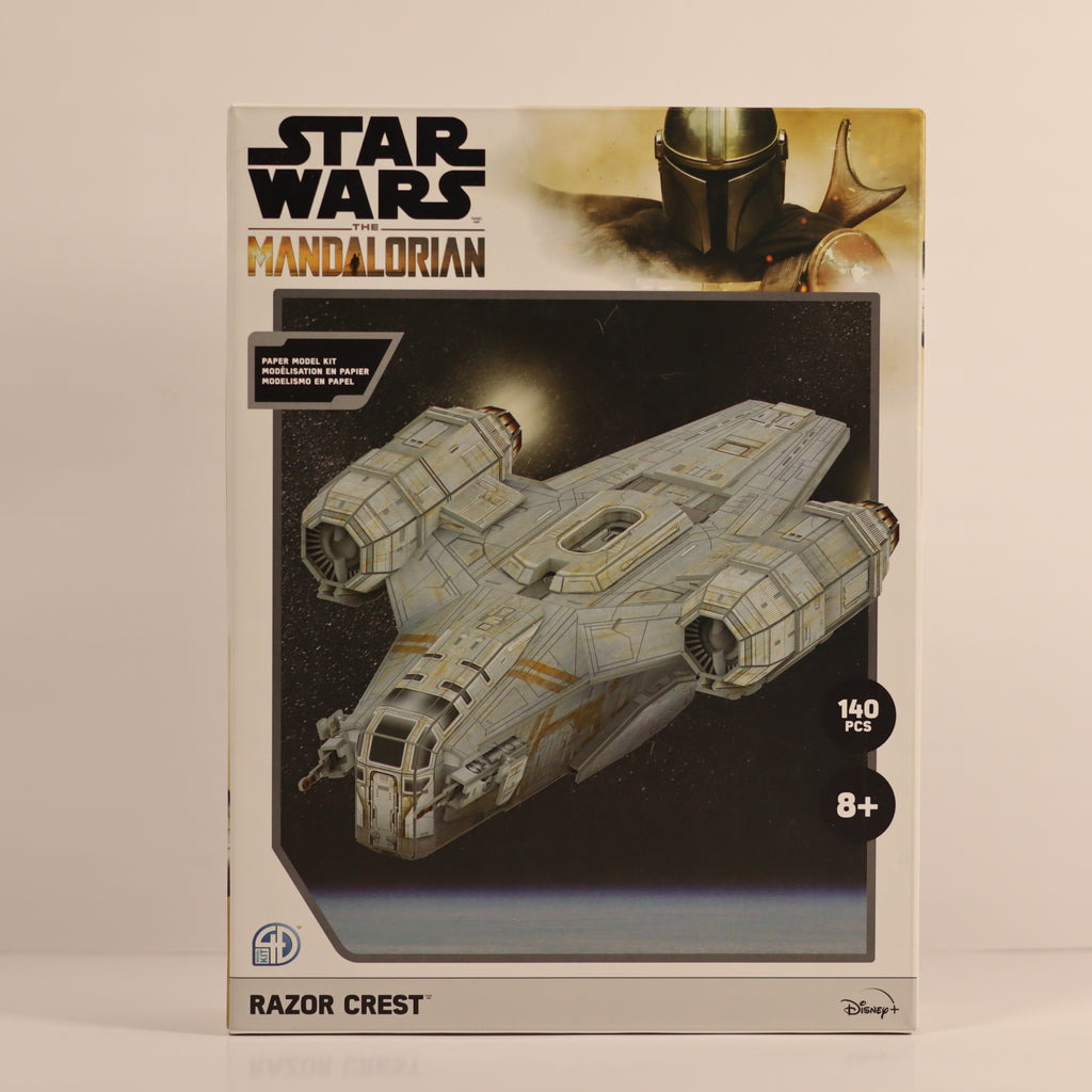 Star Wars Mandalorian Razor Crest model kit packaging on a beige background