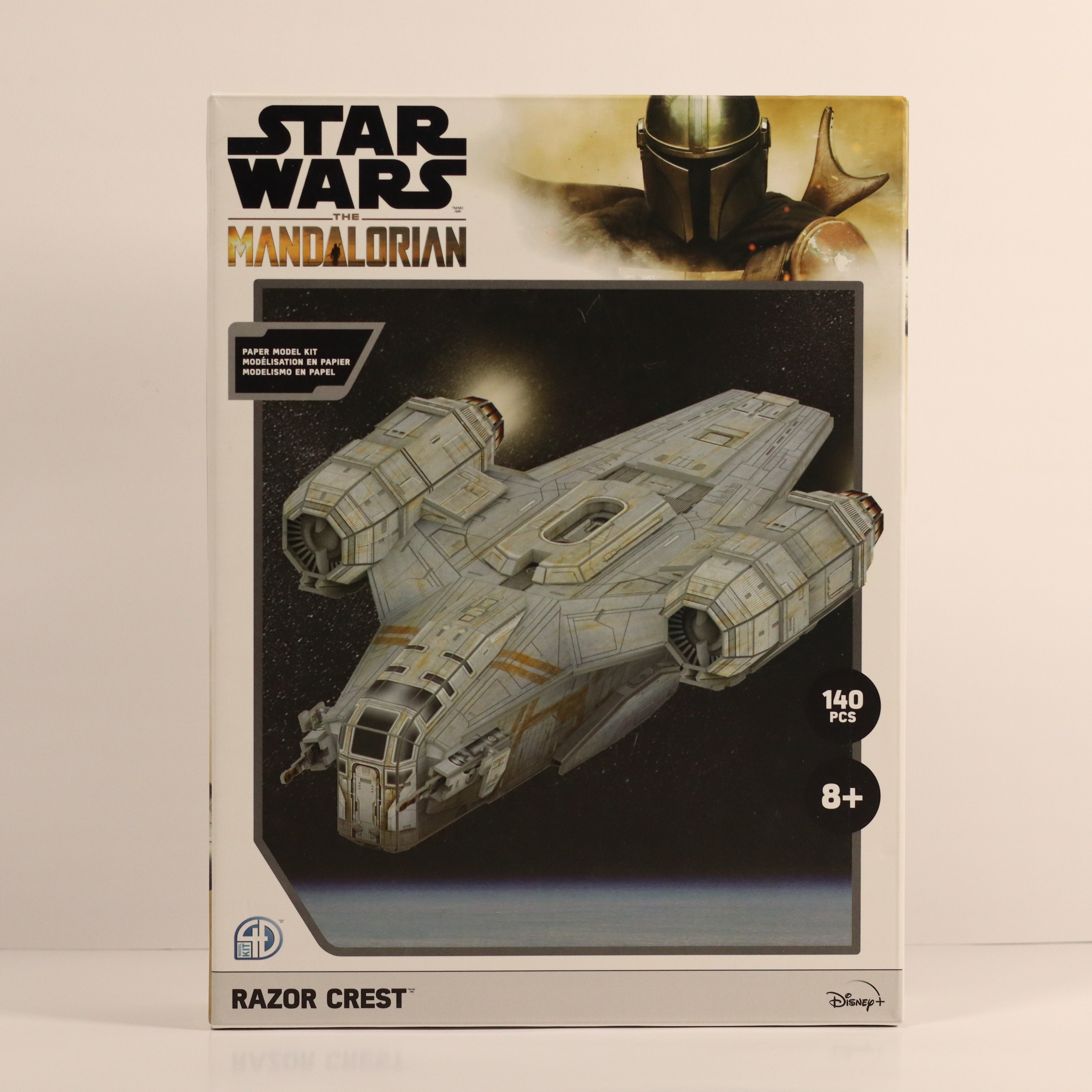 Star Wars Mandalorian Razor Crest model kit packaging on a beige background