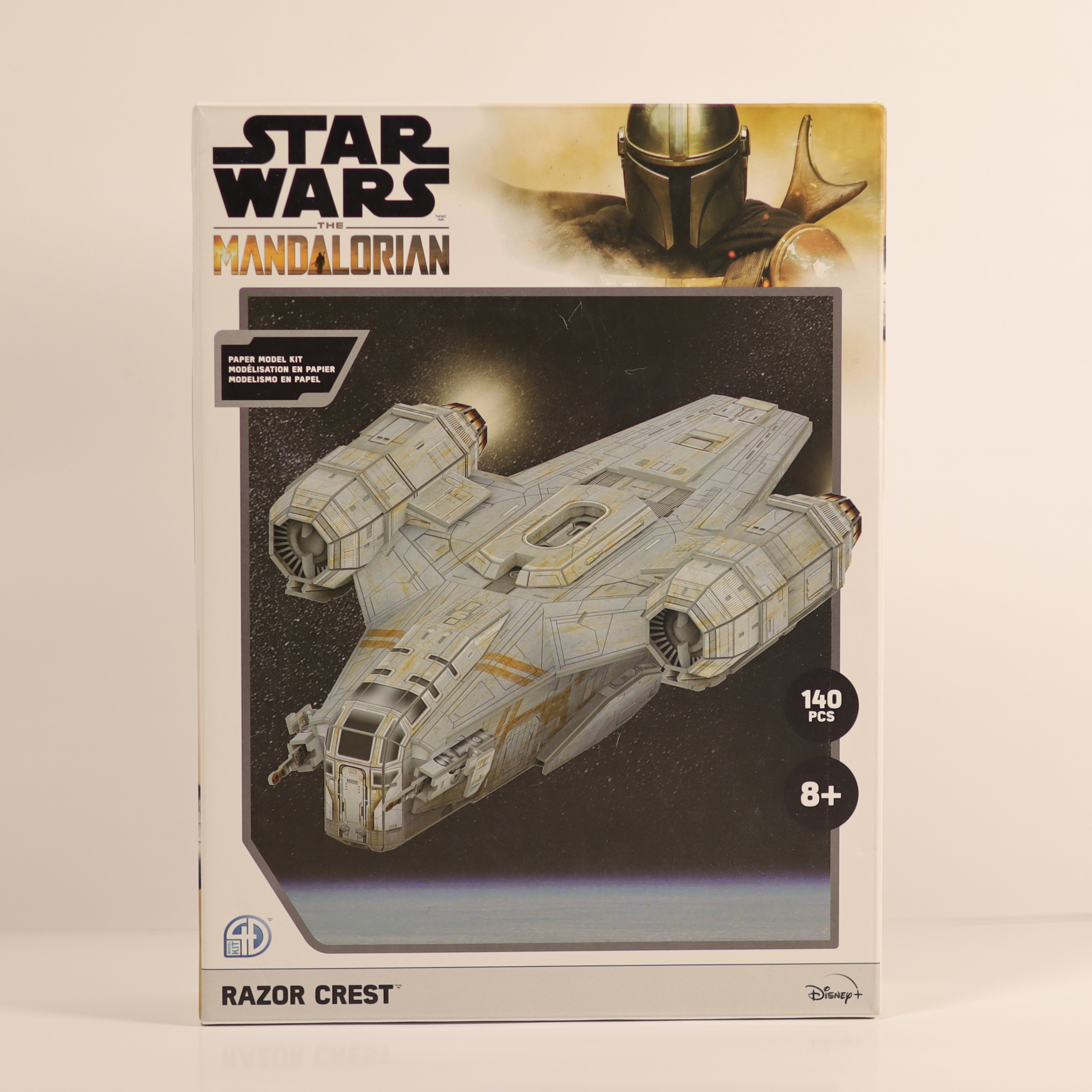 Star Wars Mandalorian Razor Crest model kit packaging on a beige background