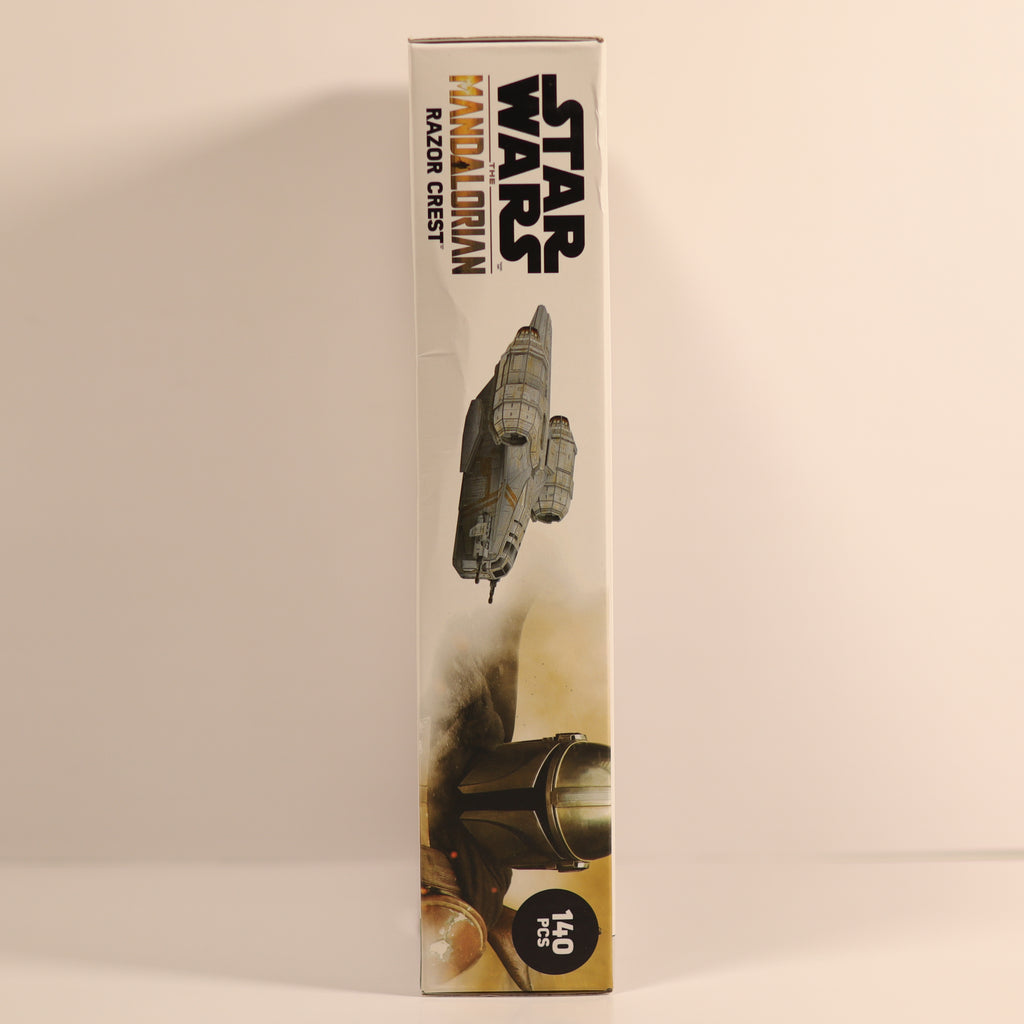 Star Wars toy packaging with 'Mandalorian' text and character images on a beige background