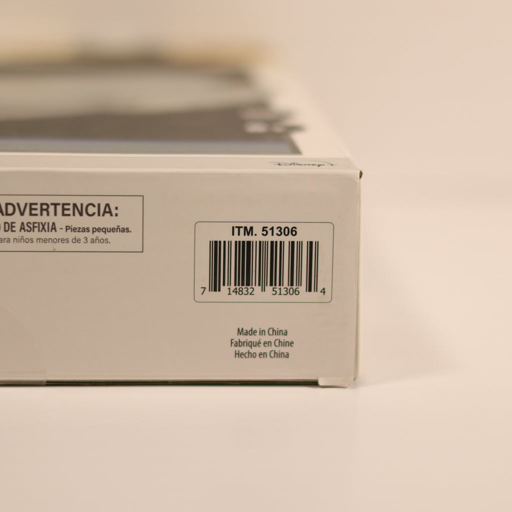 Product packaging with a warning label and barcode on a beige background