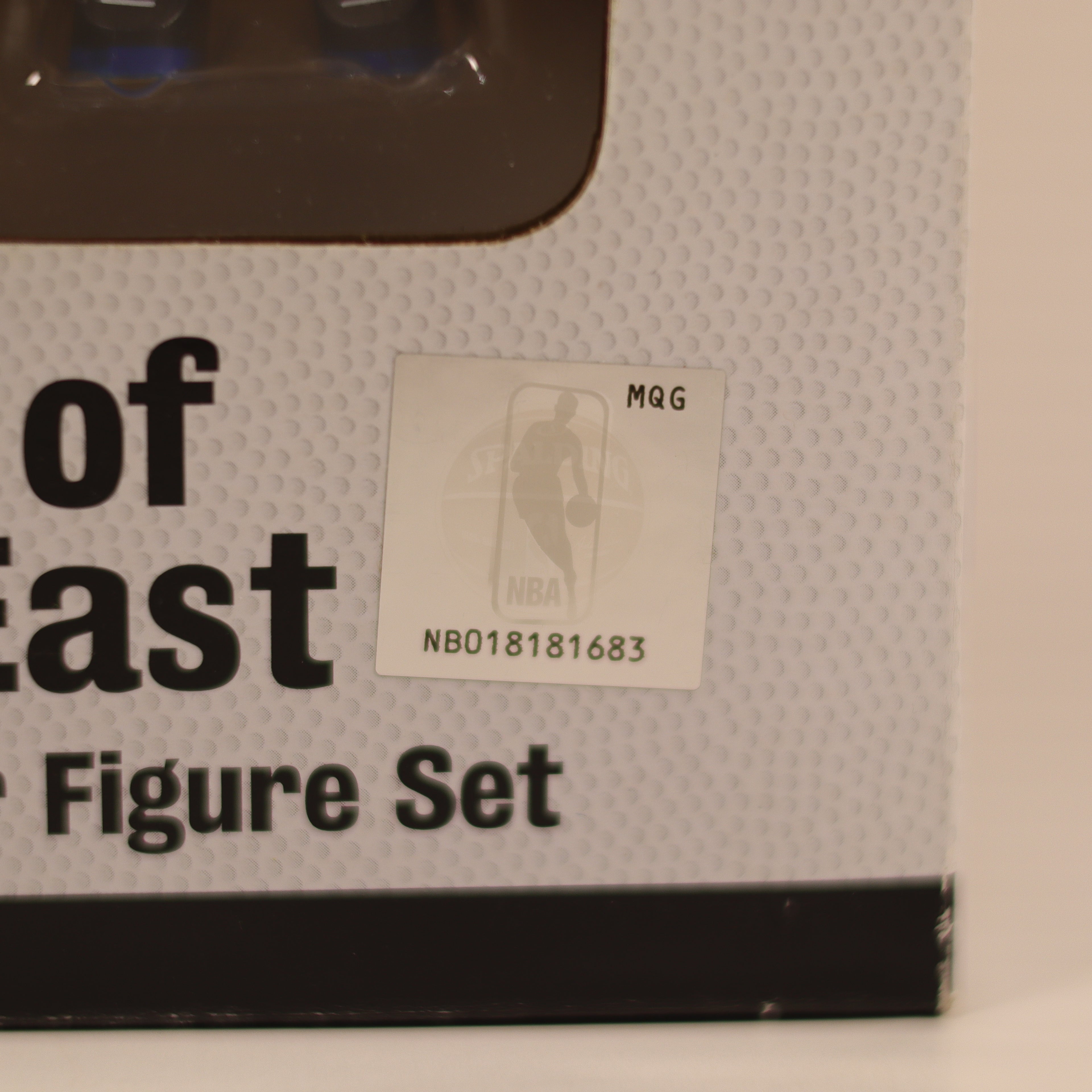 Box of NBA Figure Set with a label on a beige background