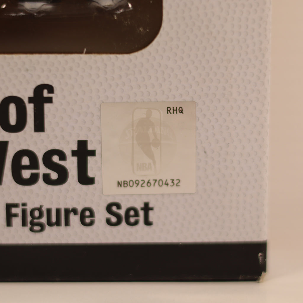 Box of 'Of West Figure Set' with a label on a beige background