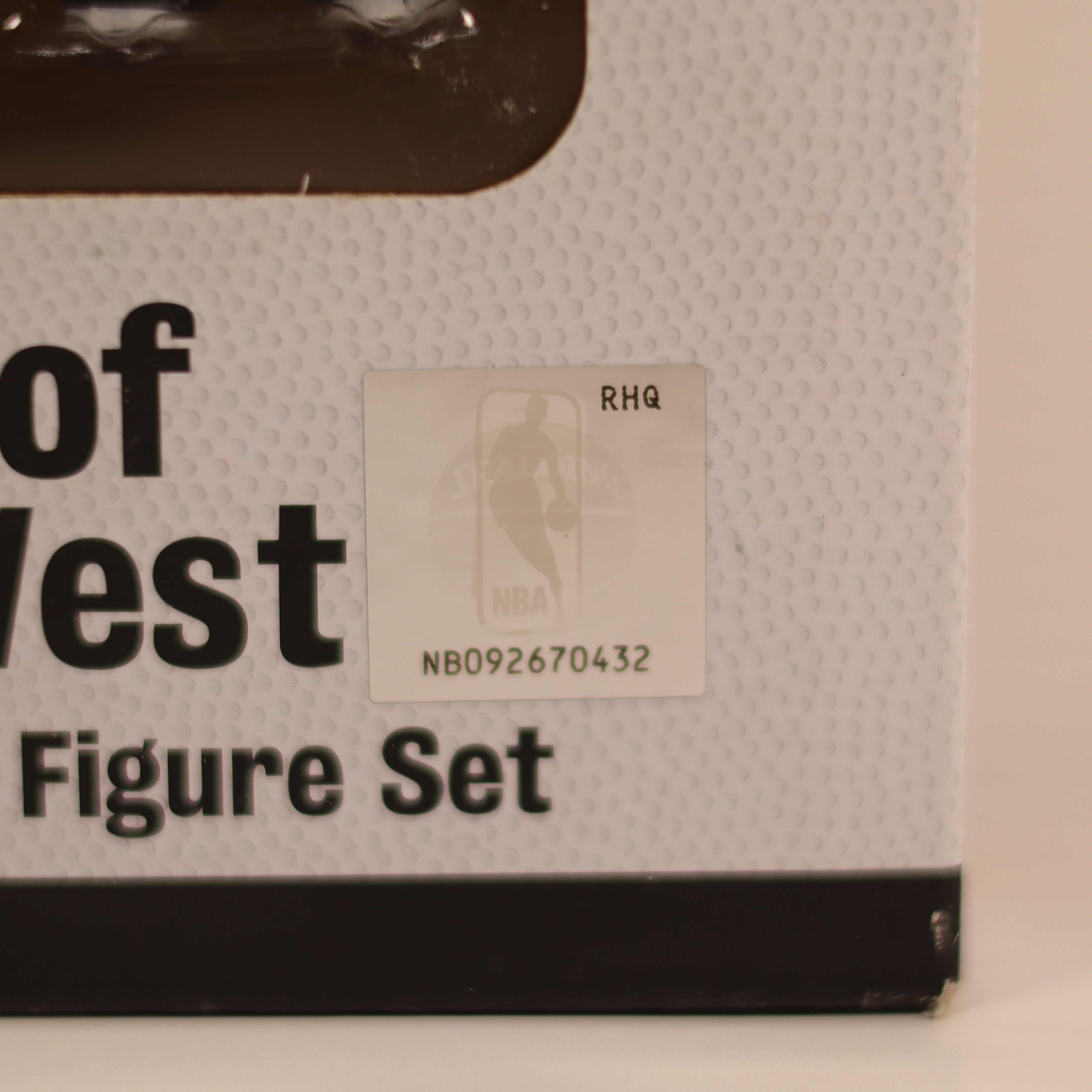 Box of 'Of West Figure Set' with a label on a beige background