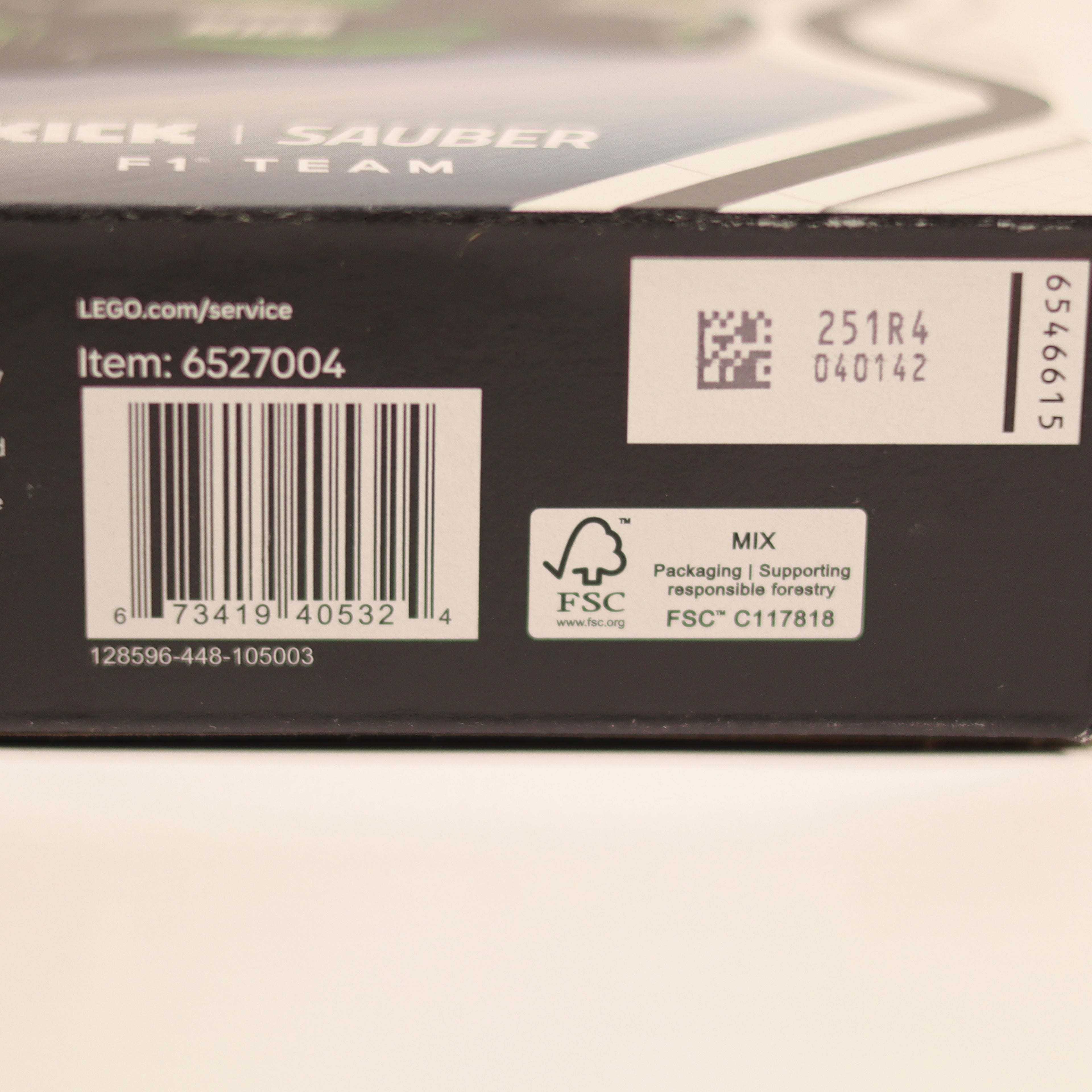 Close-up of a LEGO product packaging with barcodes and text.