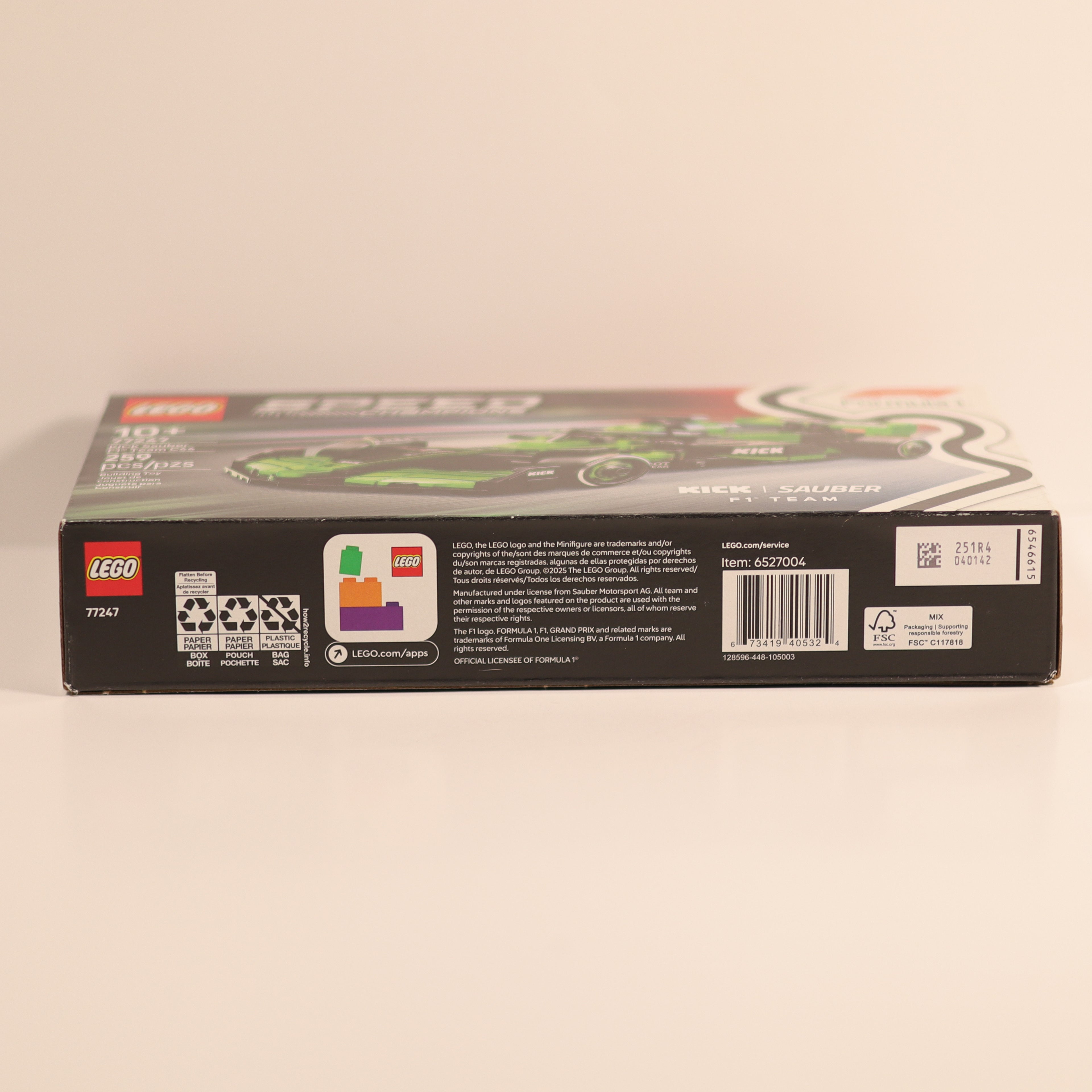 Back view of a LEGO set packaging on a beige background